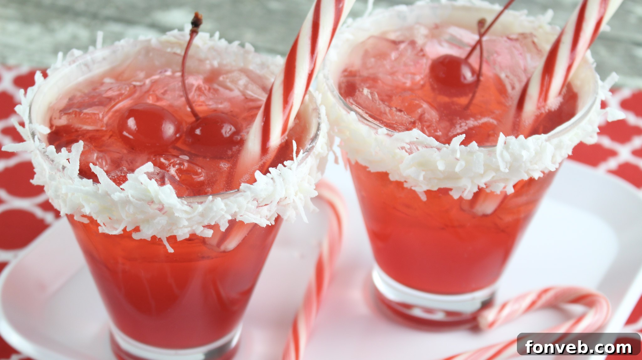 Two Santa Hat Cocktails, one with alcohol and one without, ready to be served at a holiday party.