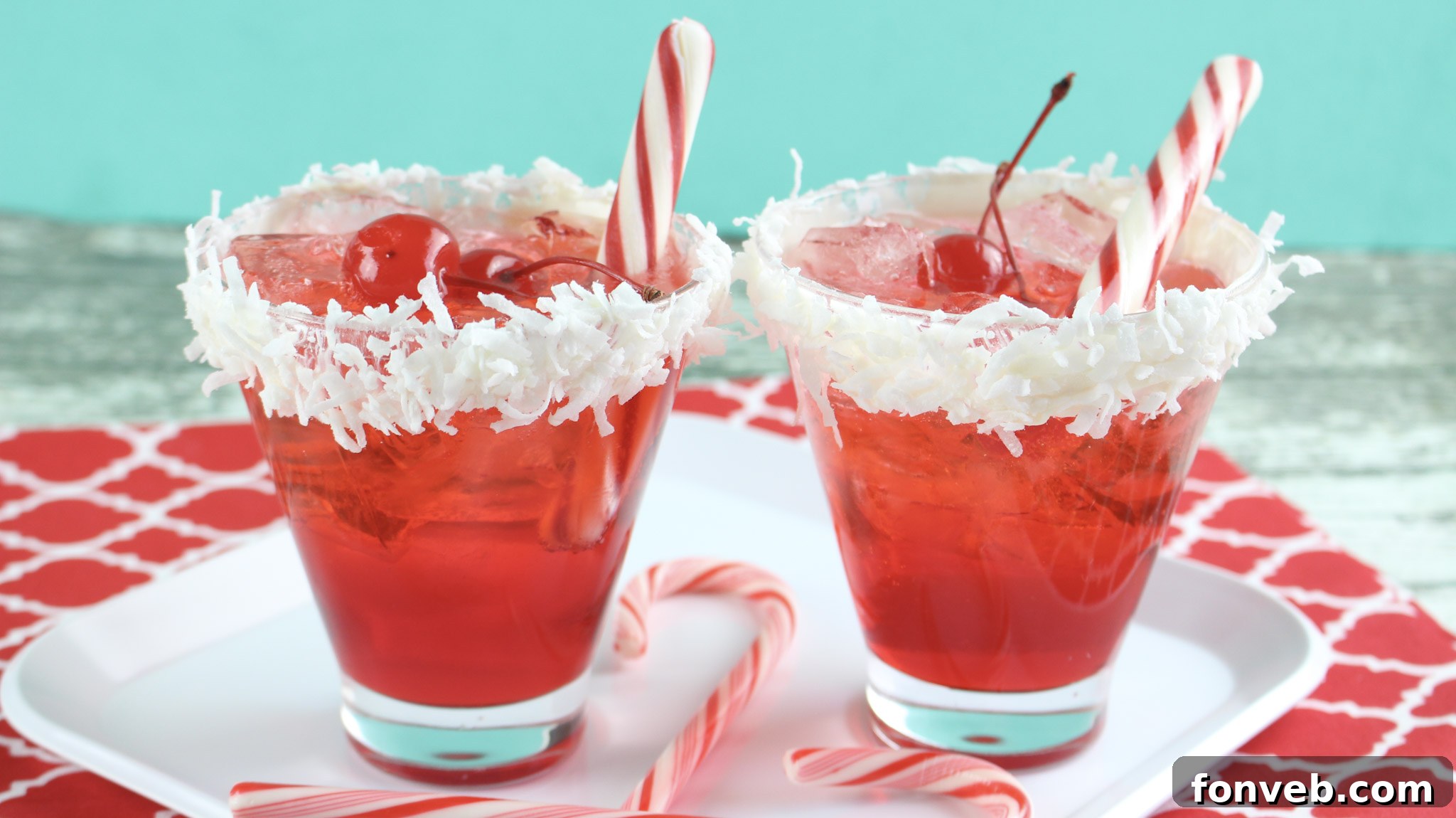 An array of delicious-looking cocktails, including the Santa Hat Cocktail, set up for a festive gathering.