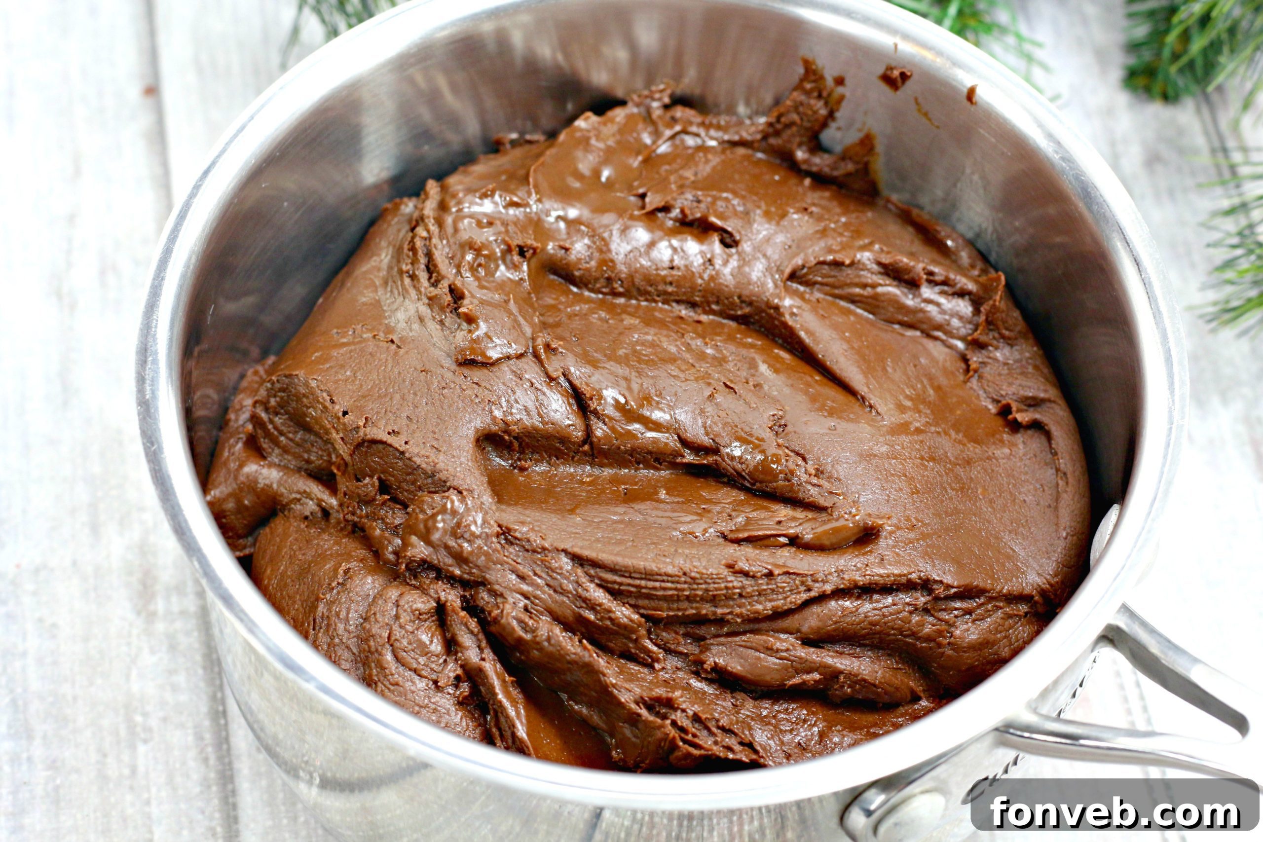 Close-up of a bowl filled with the rich, gooey chocolate Kahlua truffle mixture before chilling.