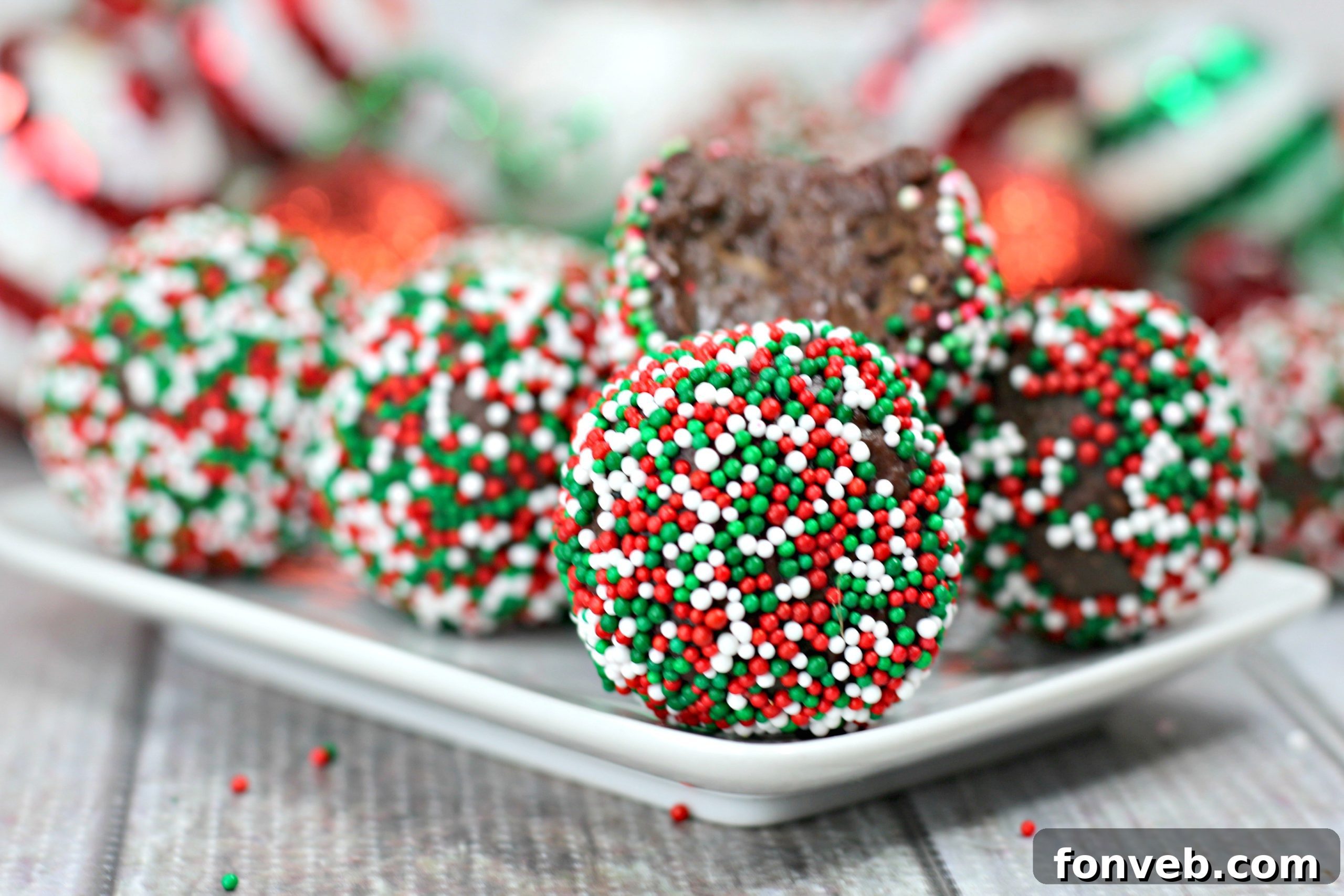 Finished chocolate Kahlua truffles with various coatings displayed beautifully on a serving platter, ready for guests.
