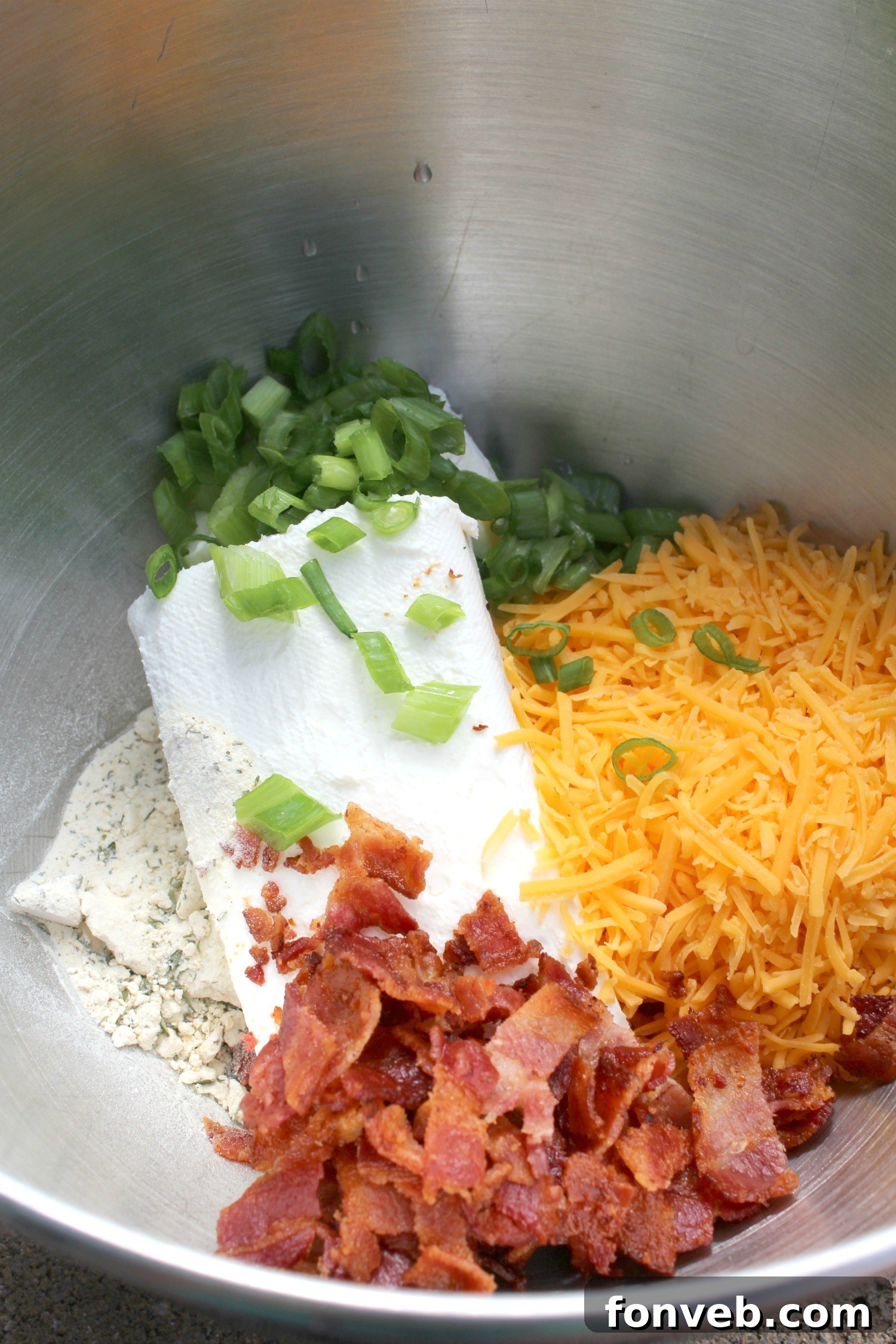 Bacon Cheddar Ranch Cheeseball served with various crackers and celery
