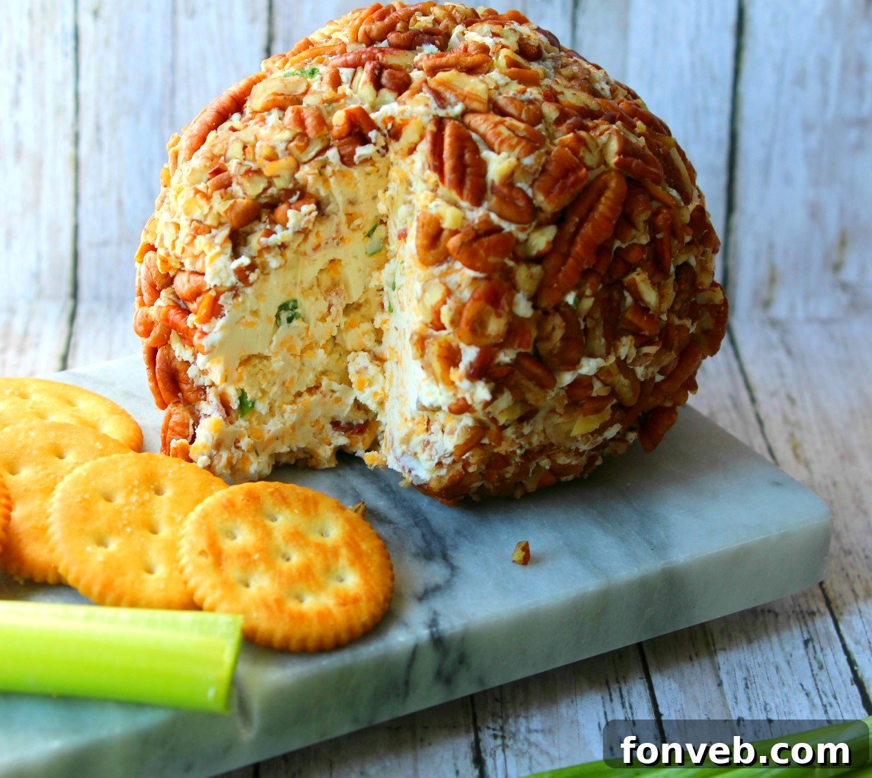 Bacon Cheddar Ranch Cheeseball coated in pecans and bacon
