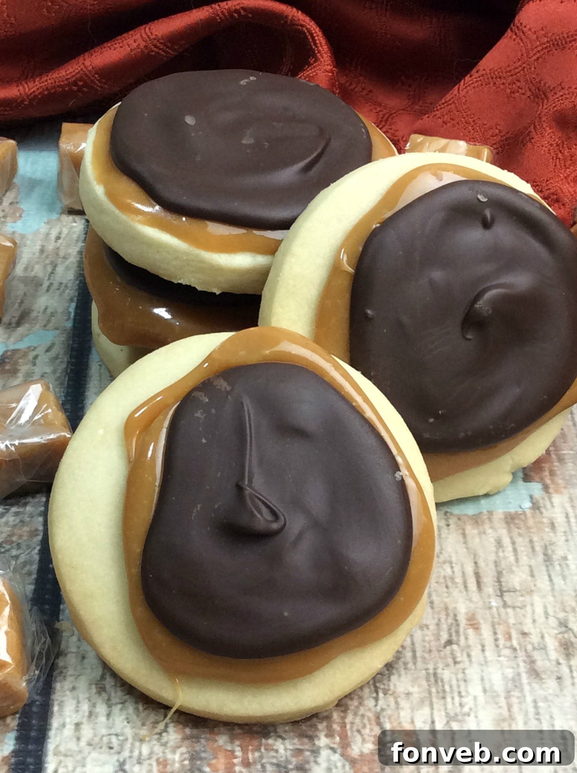 Close-up of a stack of homemade Twix cookies, highlighting their delicious layers and texture