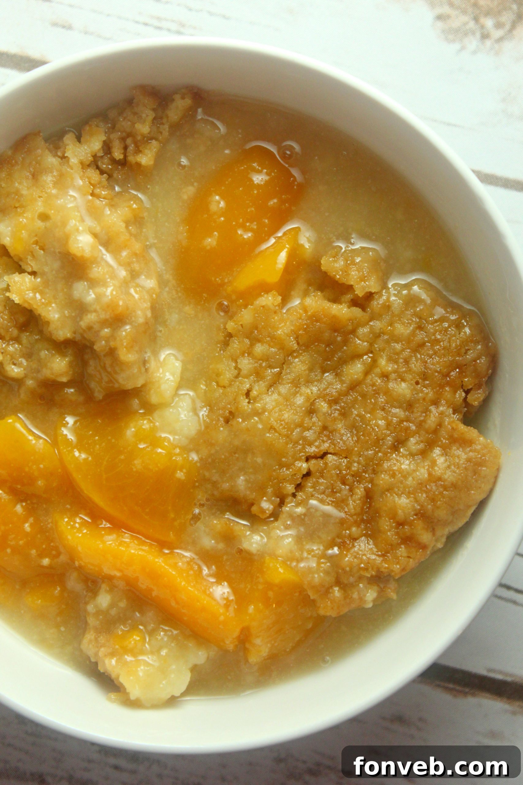 Crockpot Peach Perfection 8 Individual serving of slow cooker peach cobbler with ice cream