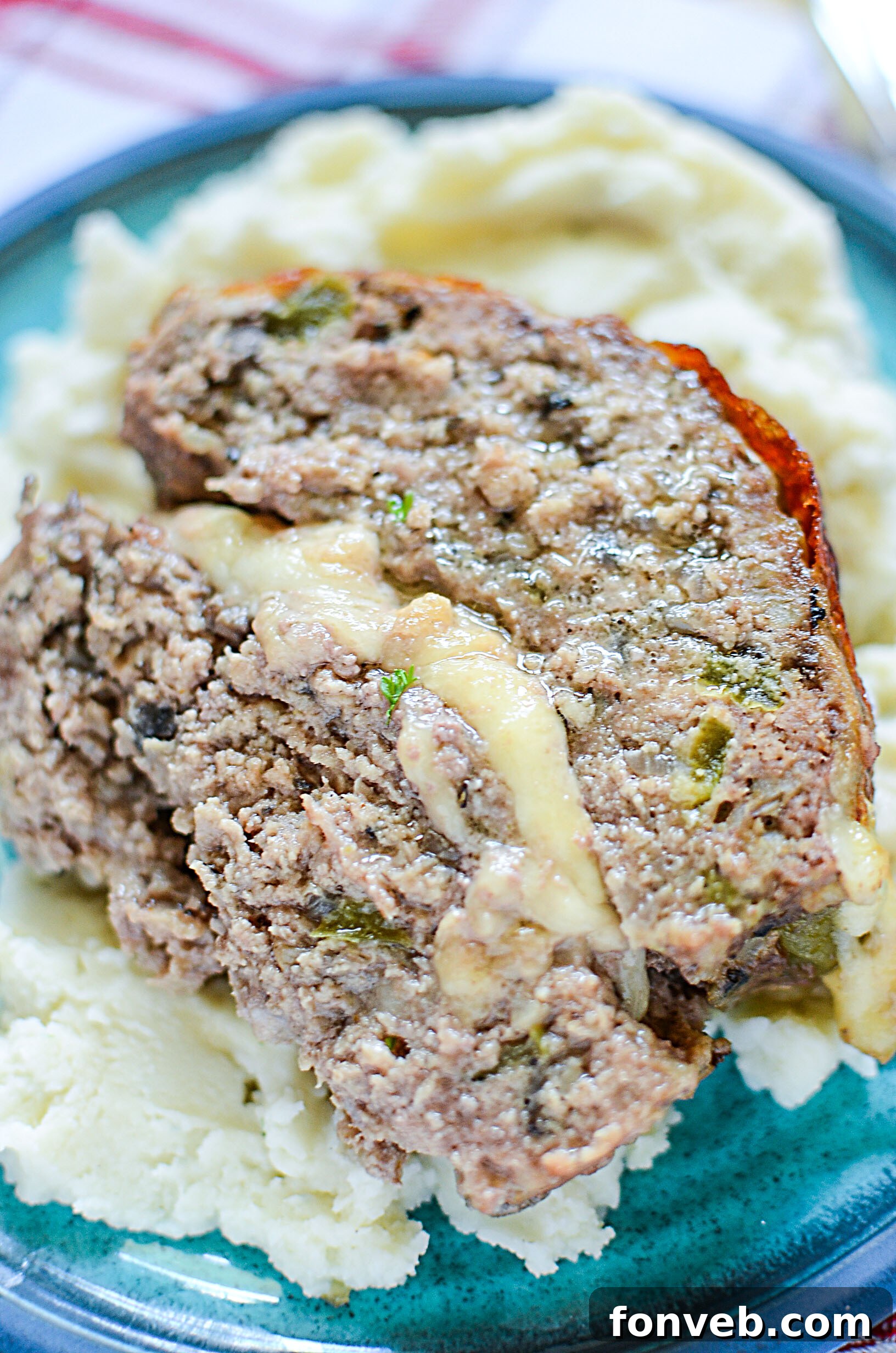 Philly Cheesesteak Meatloaf served with a side of creamy garlic mashed potatoes