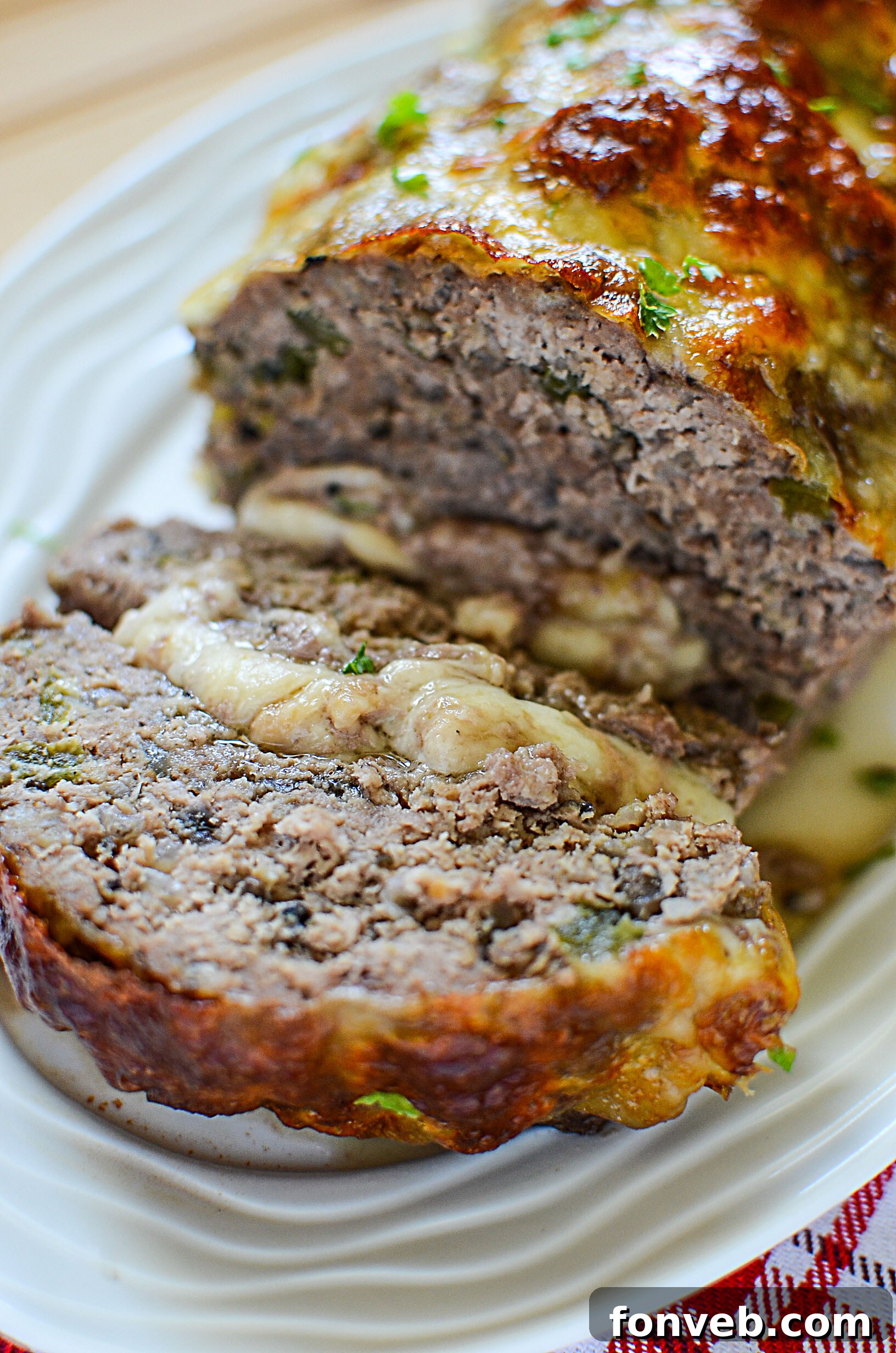 Philly Cheesesteak Meatloaf, perfectly sliced to showcase the cheese filling