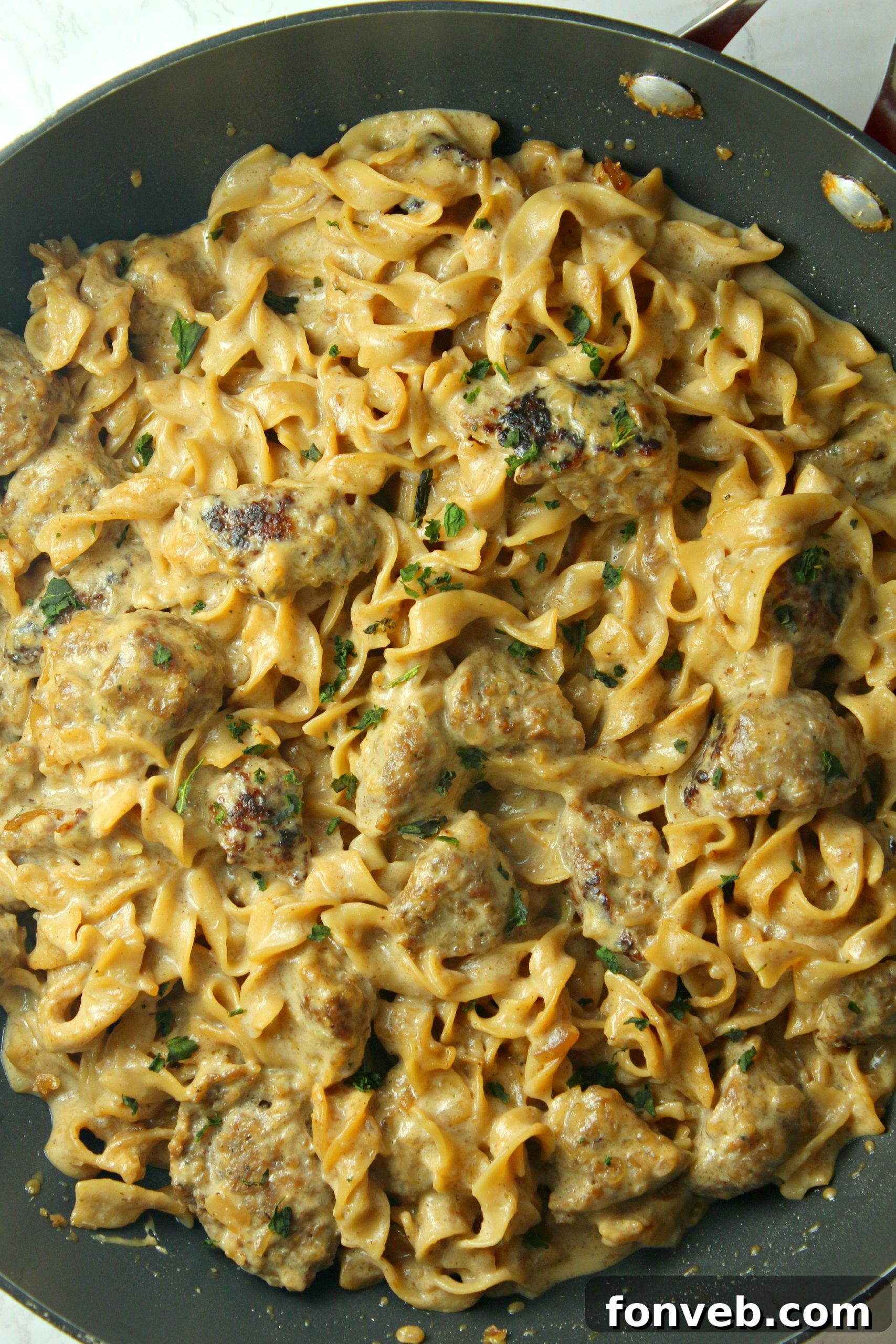 Velvety French Onion Sausage Pasta 3 Close-up shot of Creamy French Onion Sausage Pasta, showcasing the creamy sauce, tender noodles, and browned sausage.