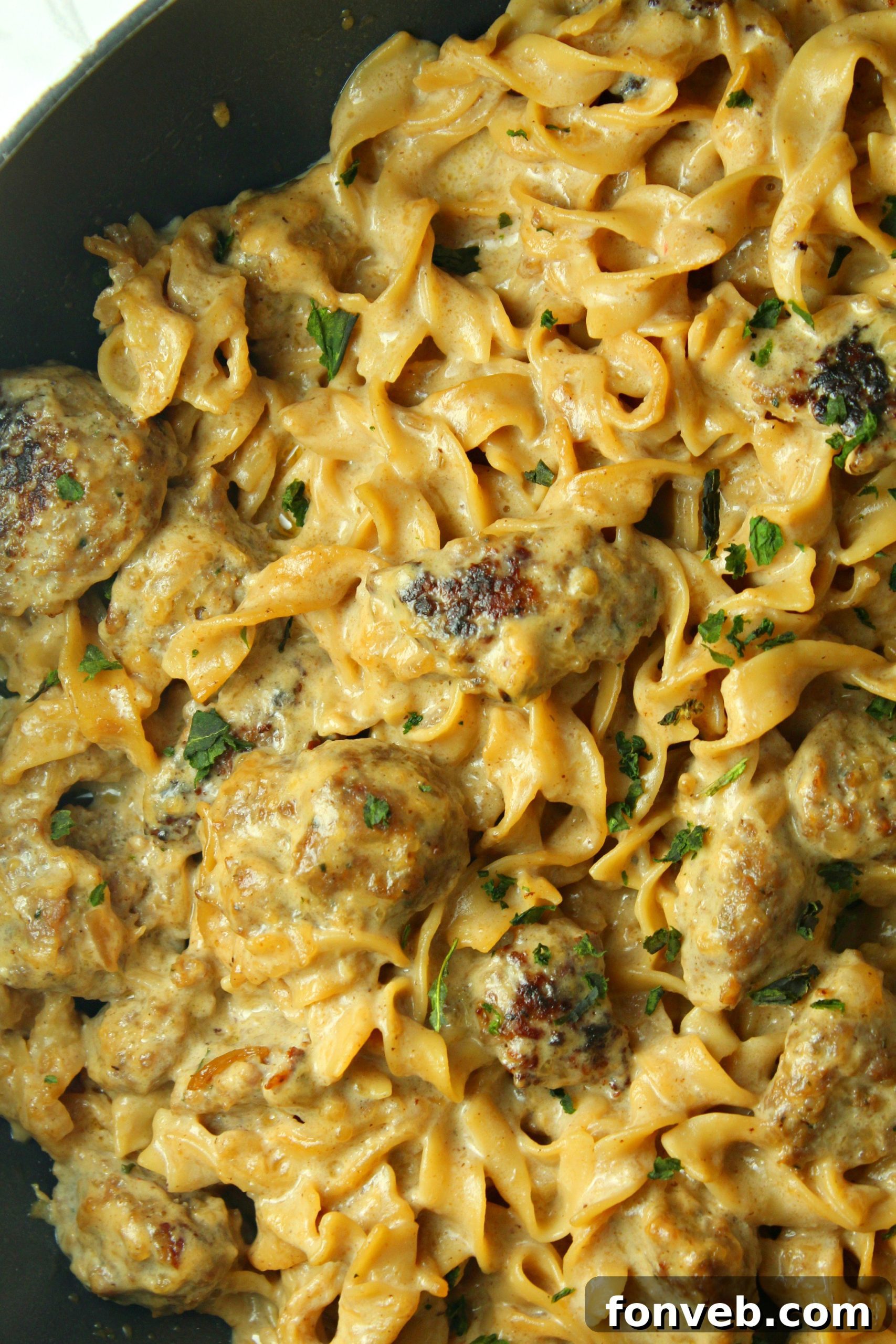 Velvety French Onion Sausage Pasta 5 A large pot filled with Creamy French Onion Sausage Pasta, ready to be served.