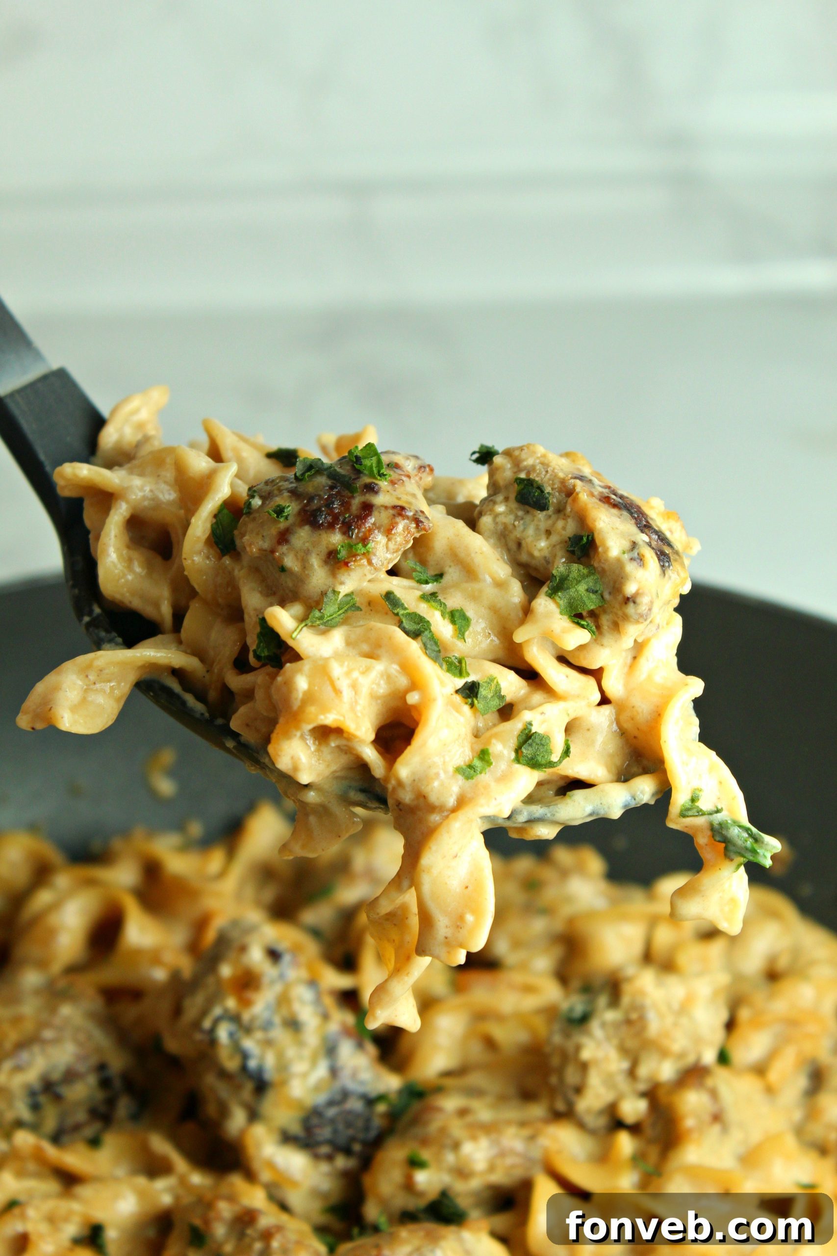 Velvety French Onion Sausage Pasta 6 Close-up of the French Onion Sausage Pasta, showing the melted cream cheese and rich sauce.