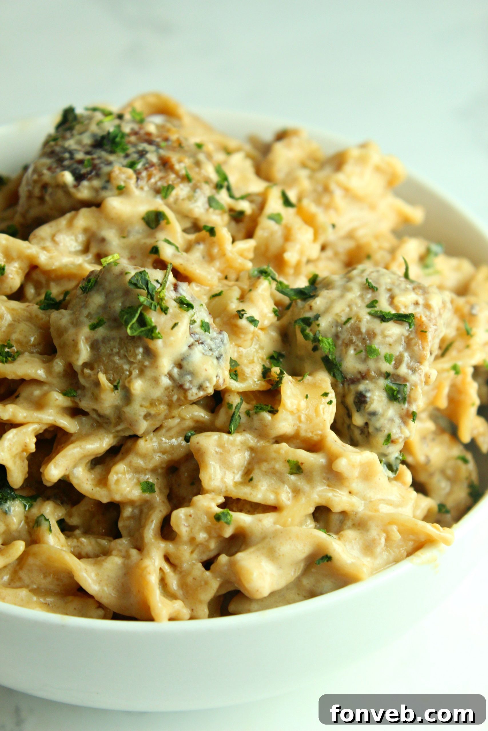 Velvety French Onion Sausage Pasta 10 A large pot of Creamy French Onion Sausage Pasta, showcasing the rich color and inviting texture of the dish.