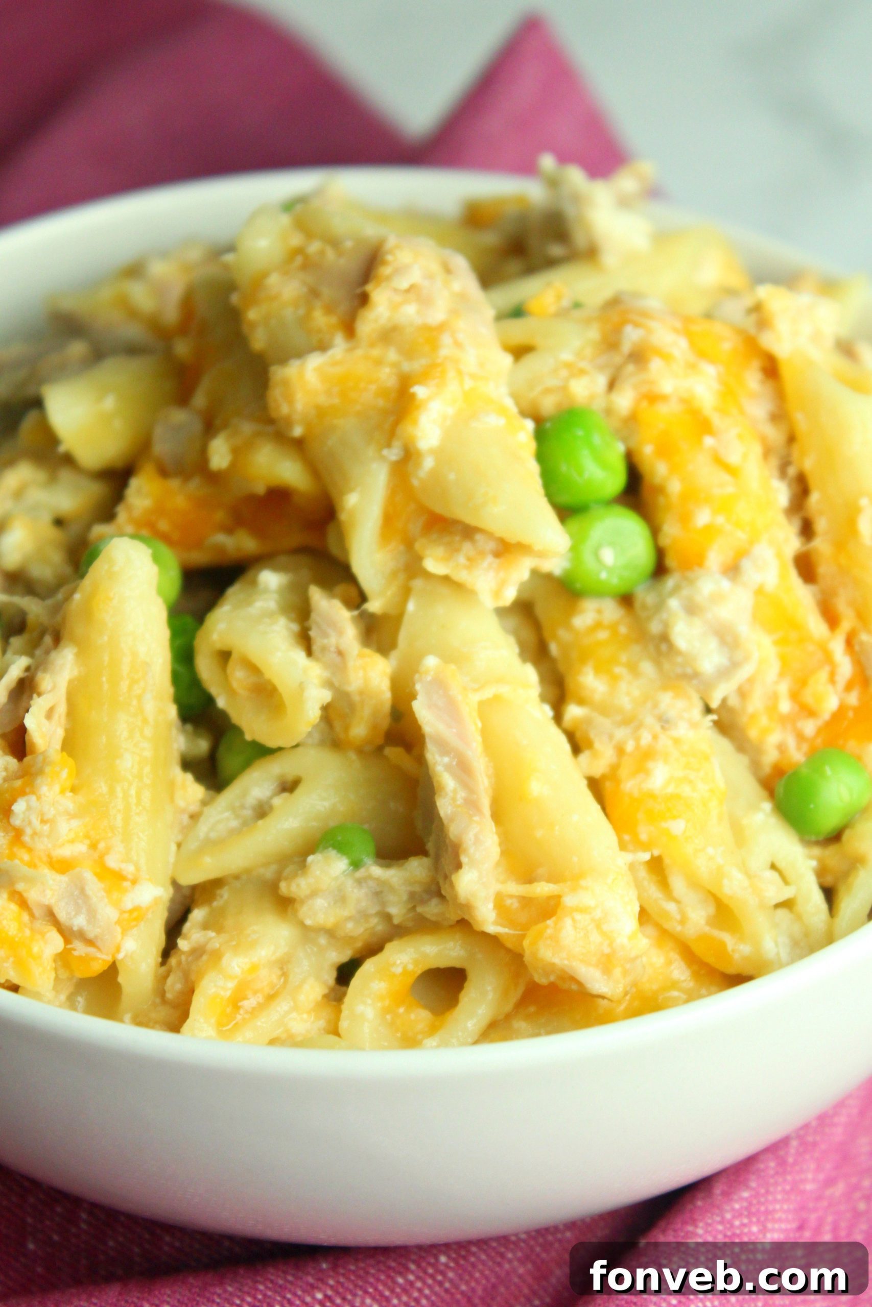 Golden Tuna Cheese Bake 6 A generous serving of Cheesy Tuna Casserole in a bowl, showcasing the rich, golden cheese and the mixed ingredients.