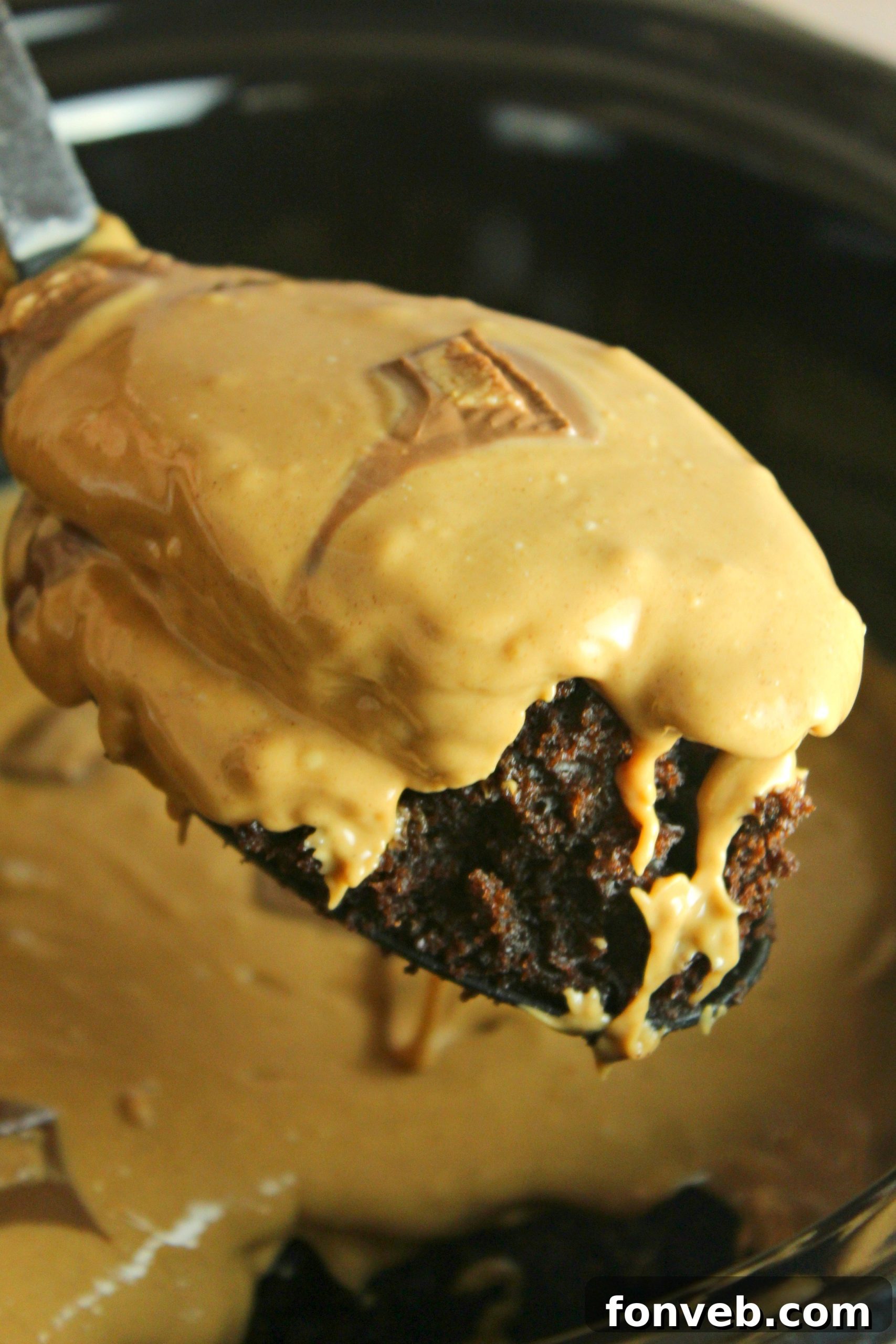 Slow Cooker Reeses Peanut Butter Chocolate Fudge Cake 8 Overhead view of the complete slow cooker Reese's peanut butter chocolate cake with frosting and toppings