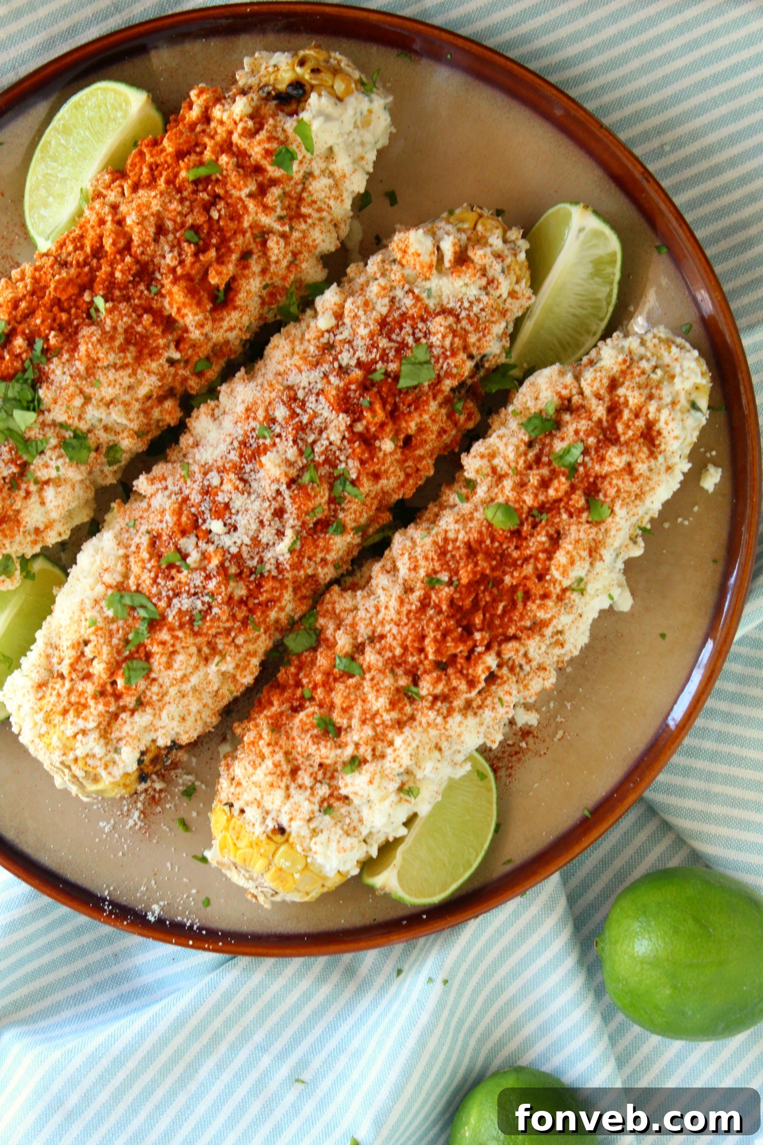 Close-up of Mexican Street Corn, showing the creamy coating and spices.