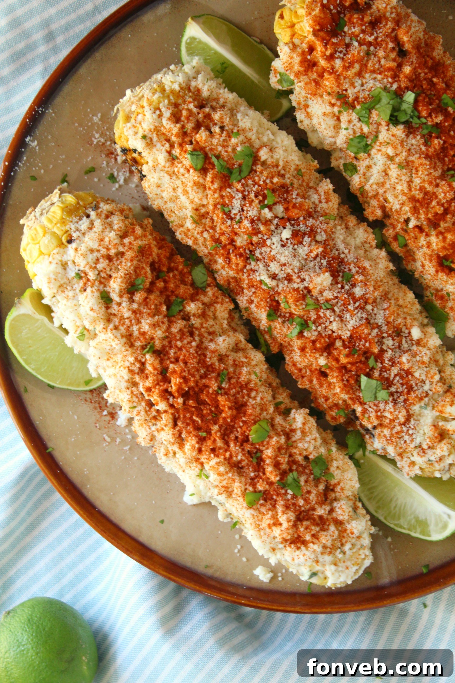 Finished Mexican Street Corn on a serving plate.