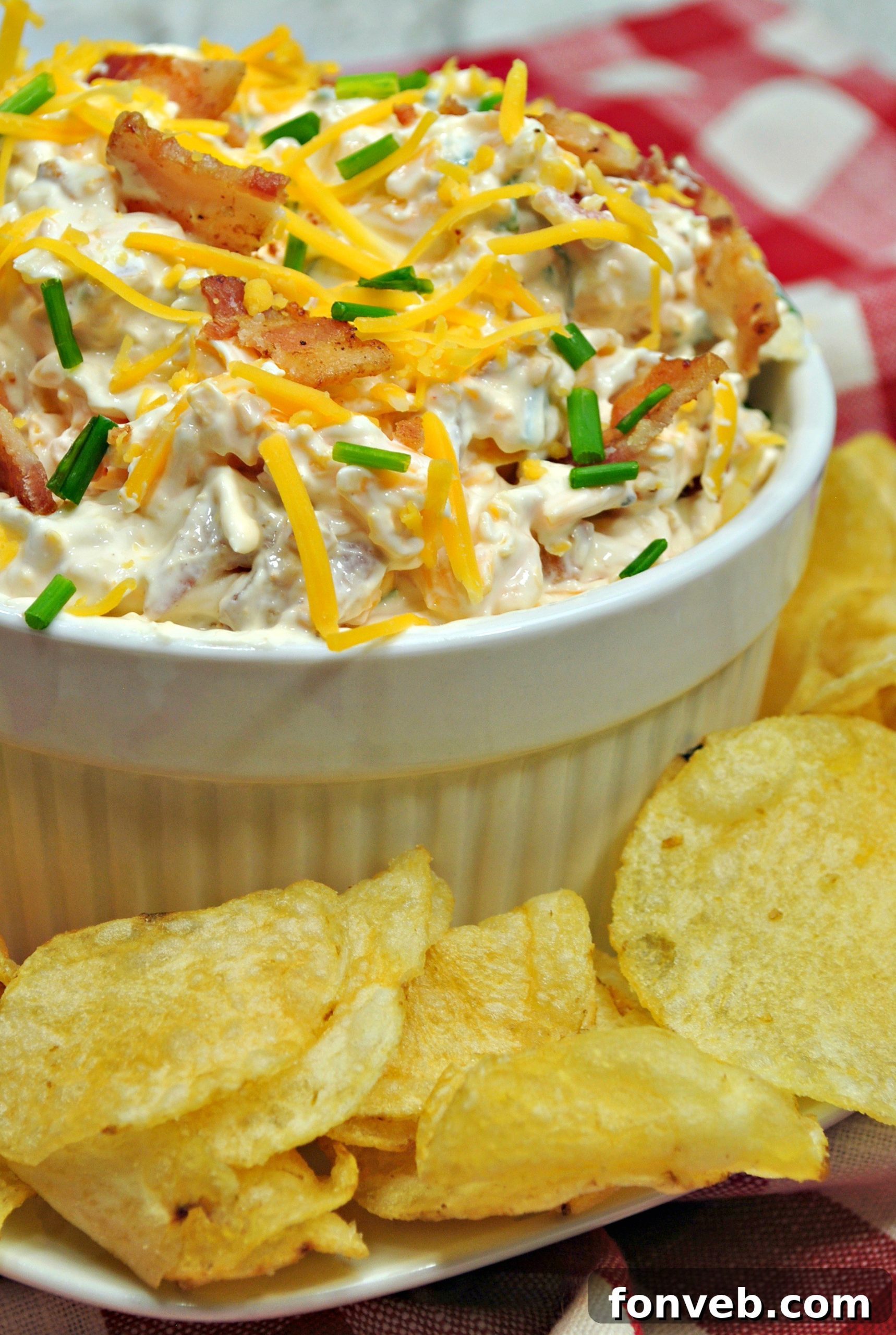 A bowl of Million Dollar Bacon Dip with chips