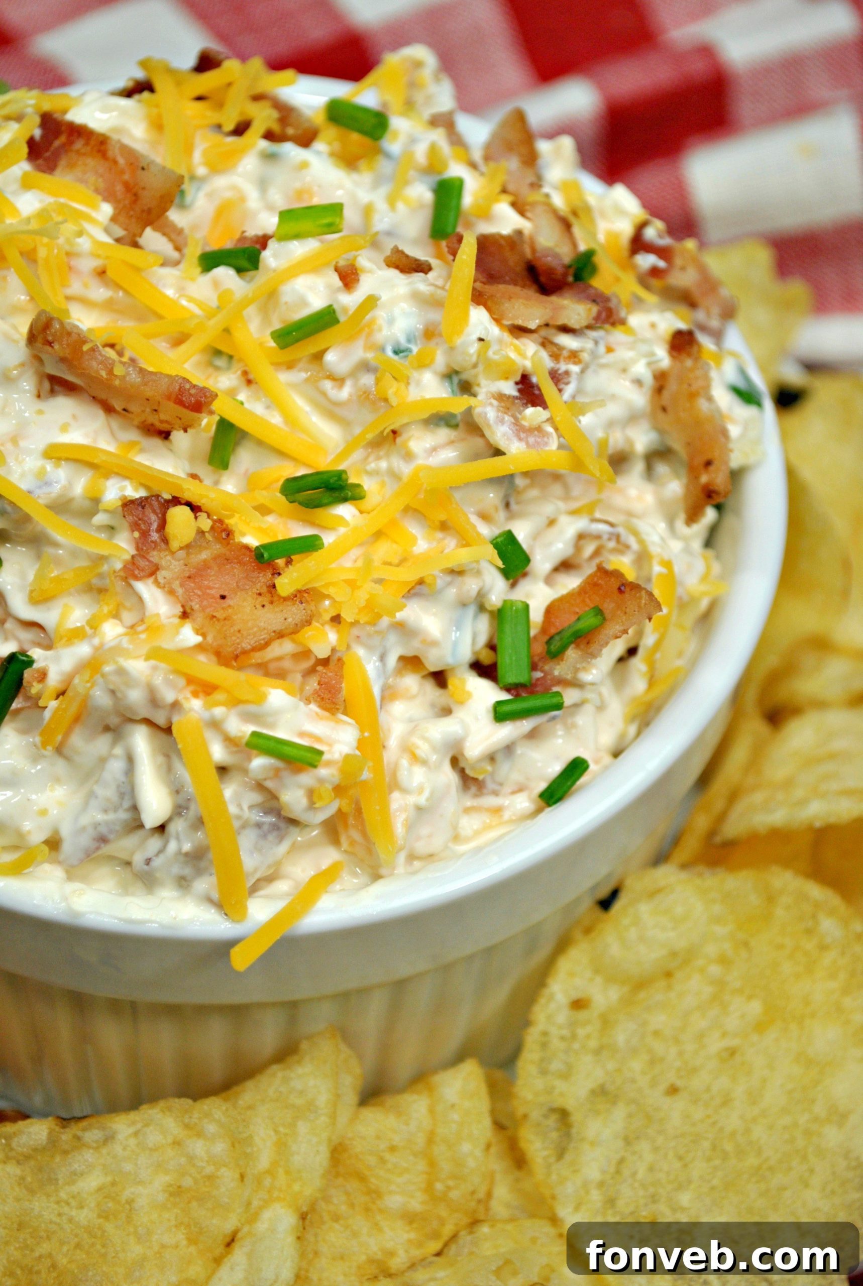 Close up of Million Dollar Bacon Dip with chives