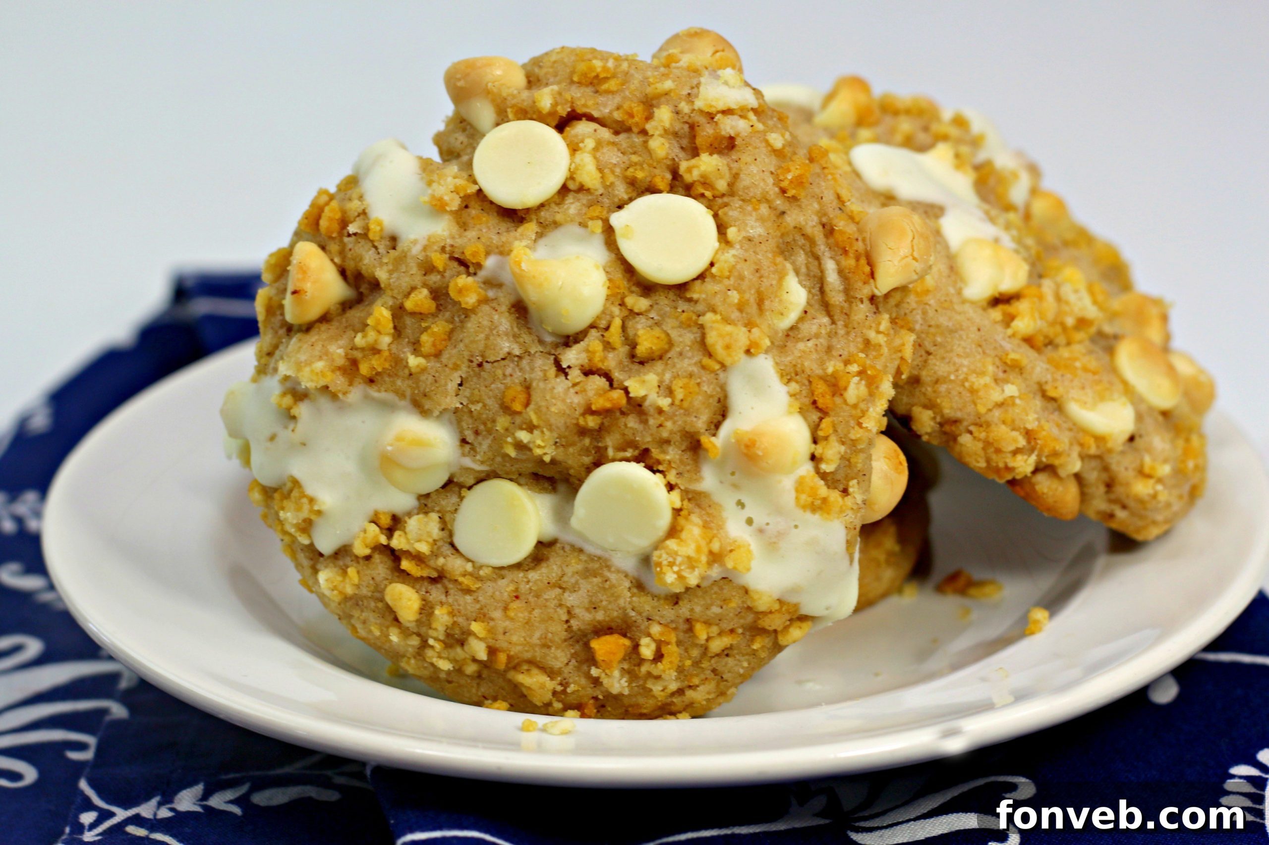 Decadent Cinnamon Roll Stuffed Cookies 5 An array of cinnamon roll stuffed cookies displayed on a baking sheet.