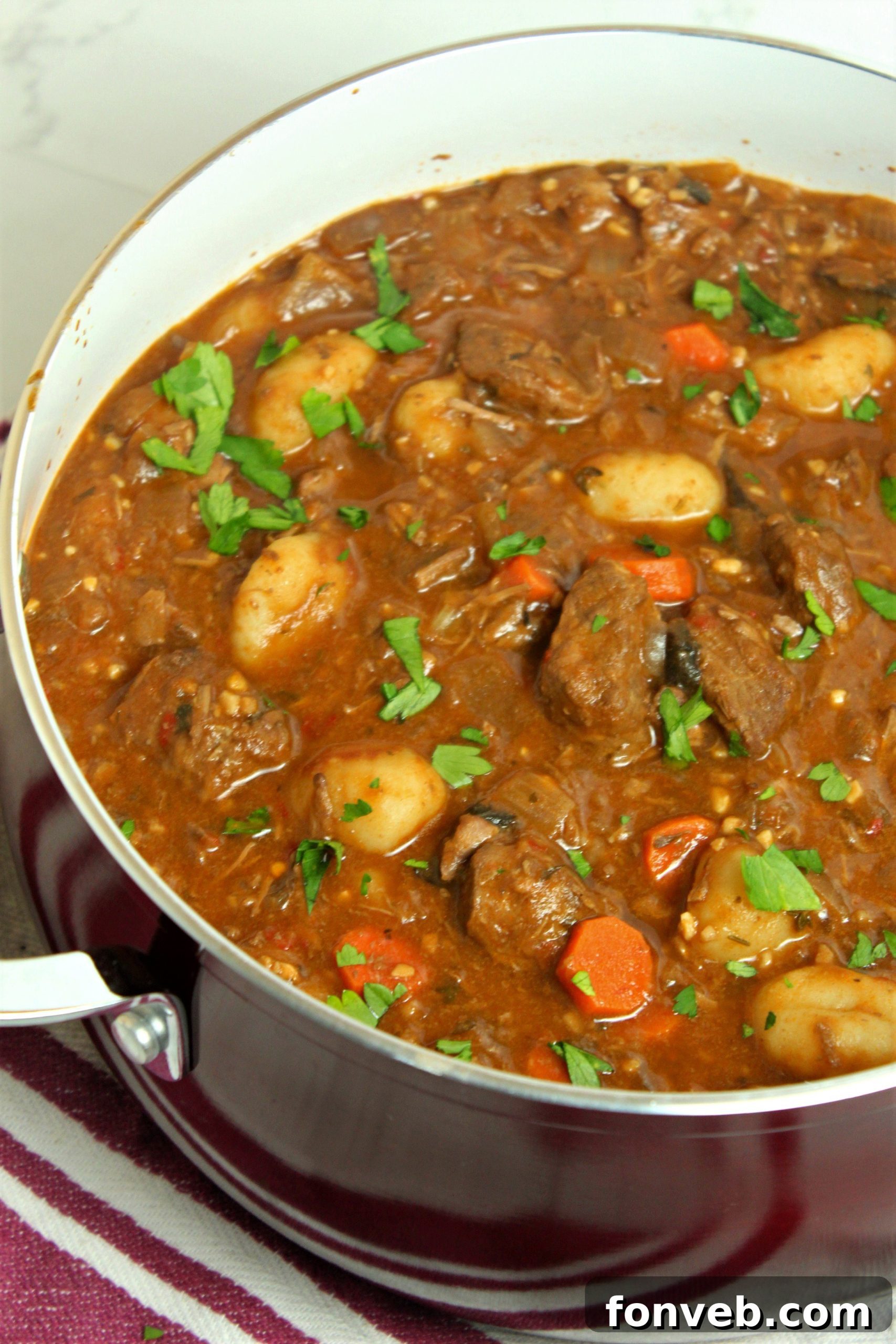 Chunky beef soup without gnocchi, featuring more vegetables, for a carb-conscious diet.