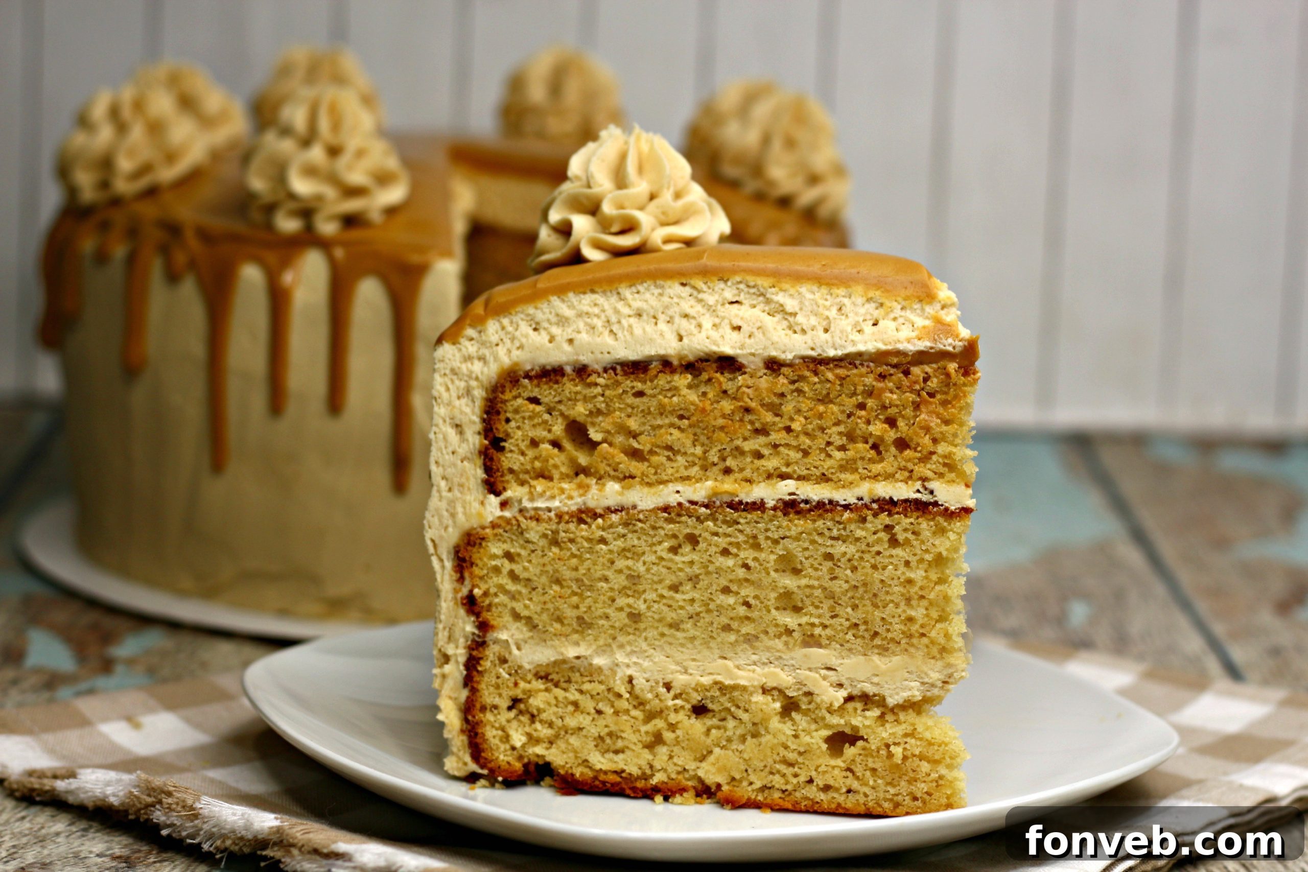 The Irresistible Peanut Butter Cake Experience 12 The entire peanut butter layered cake presented on a serving platter, showcasing its finished design and readiness to be sliced and shared.