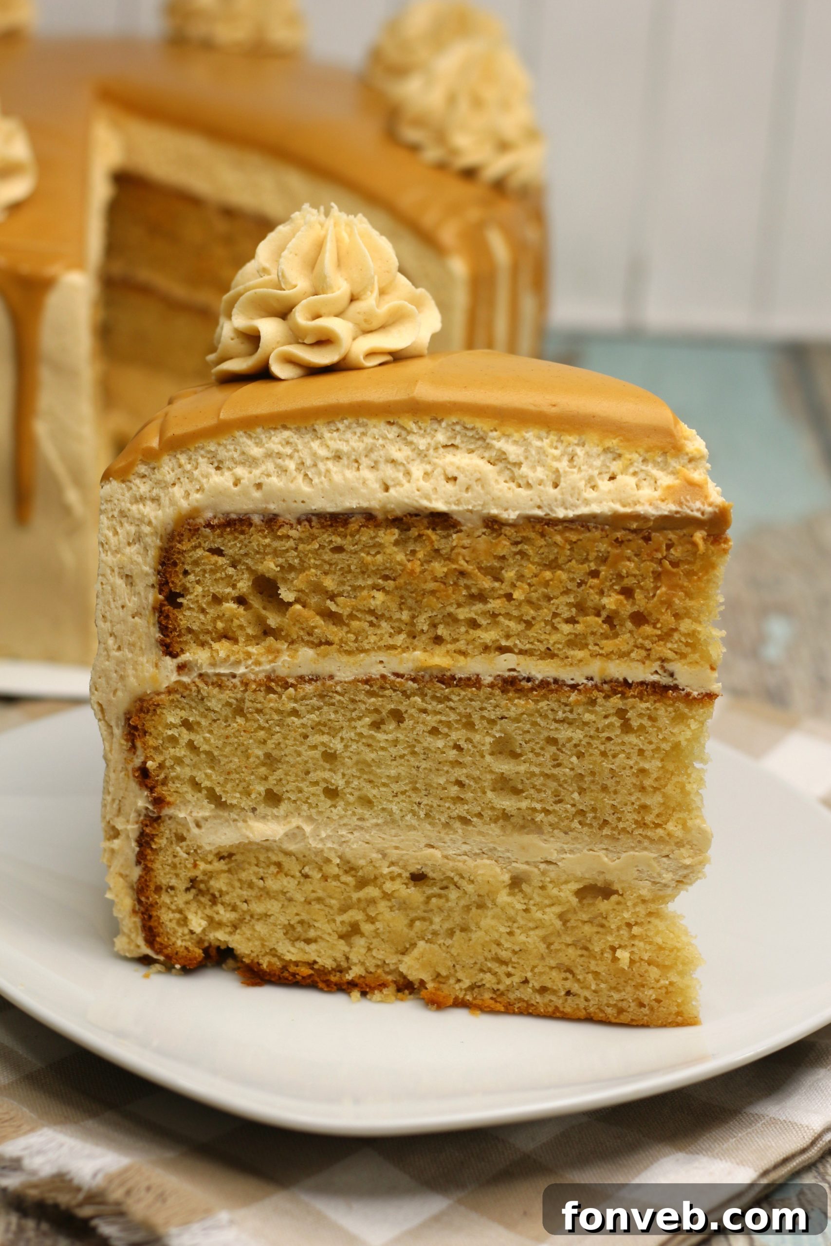 The Irresistible Peanut Butter Cake Experience 4 Overhead view of the stunning peanut butter layered cake, showcasing its elegant decoration and perfectly piped frosting rosettes.