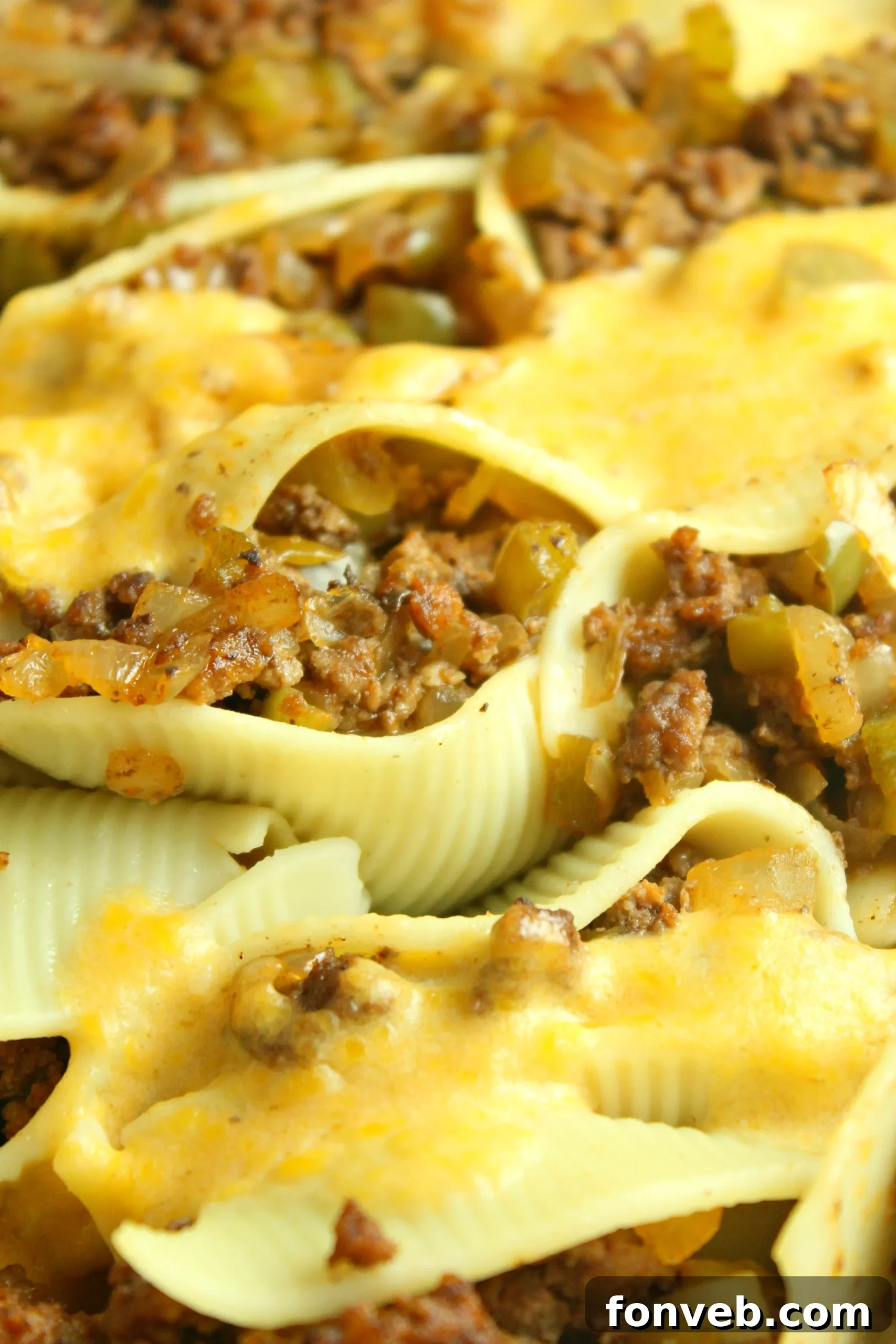 Overhead view of Philly Cheese Steak Stuffed Shells, showing the rich sauce and melted cheese.
