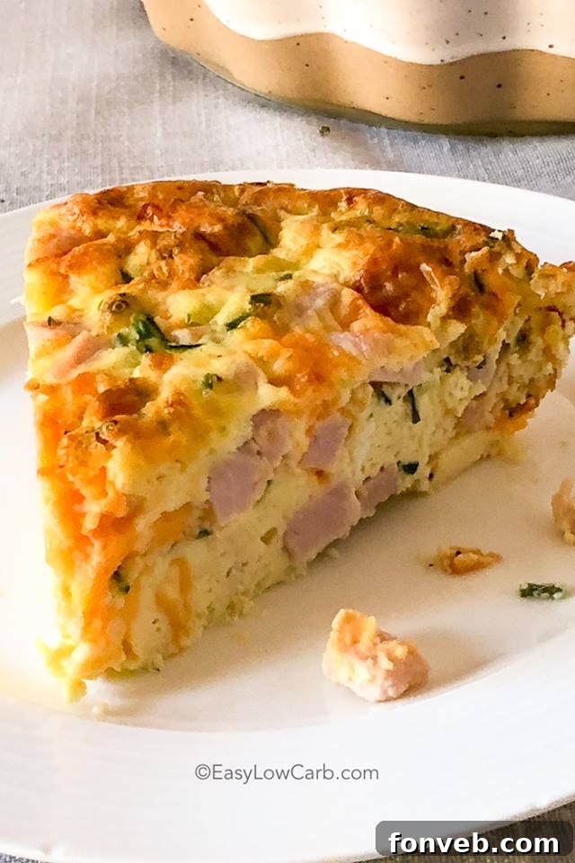 A golden-brown Crustless Ham and Cheese Quiche, sliced and ready to serve.
