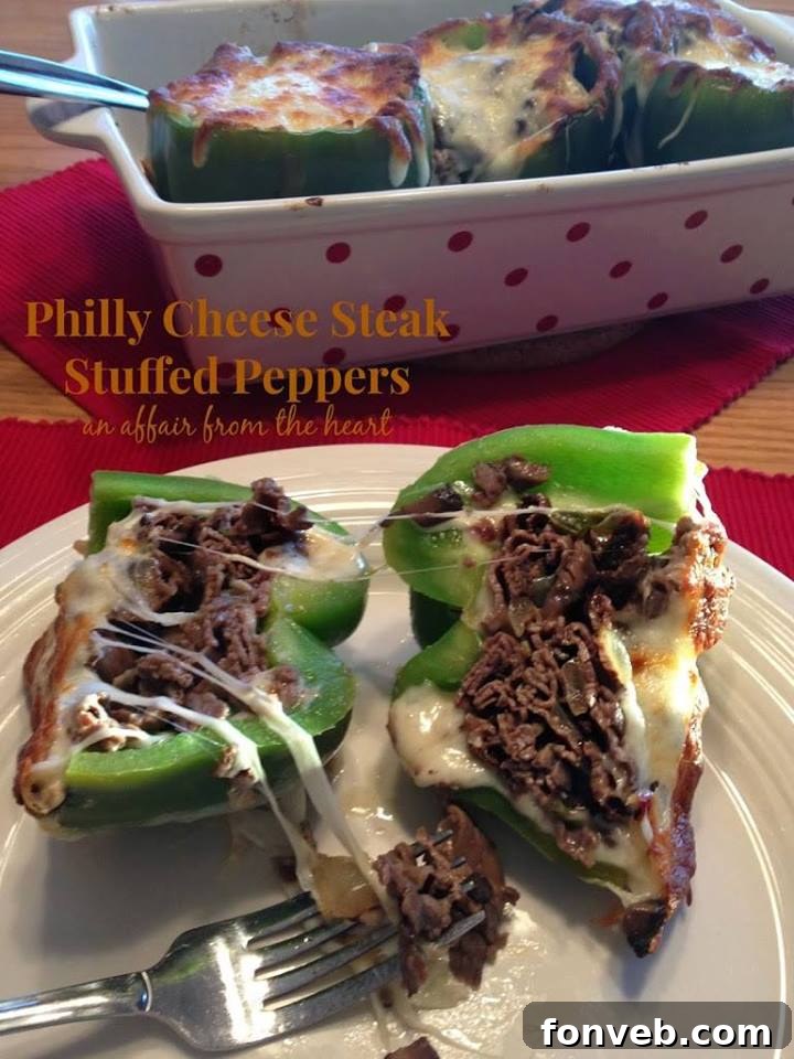 Philly Cheese Steak Stuffed Peppers, filled with steak, onions, and melted cheese.