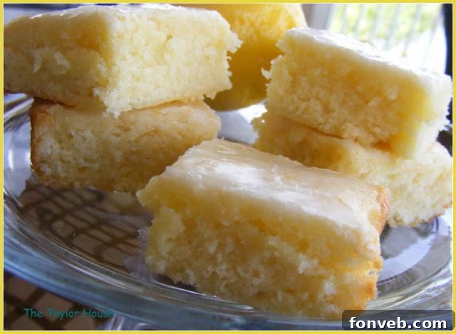 Freshly baked Lemon Brownies with a sweet lemon glaze, sliced and ready to serve.
