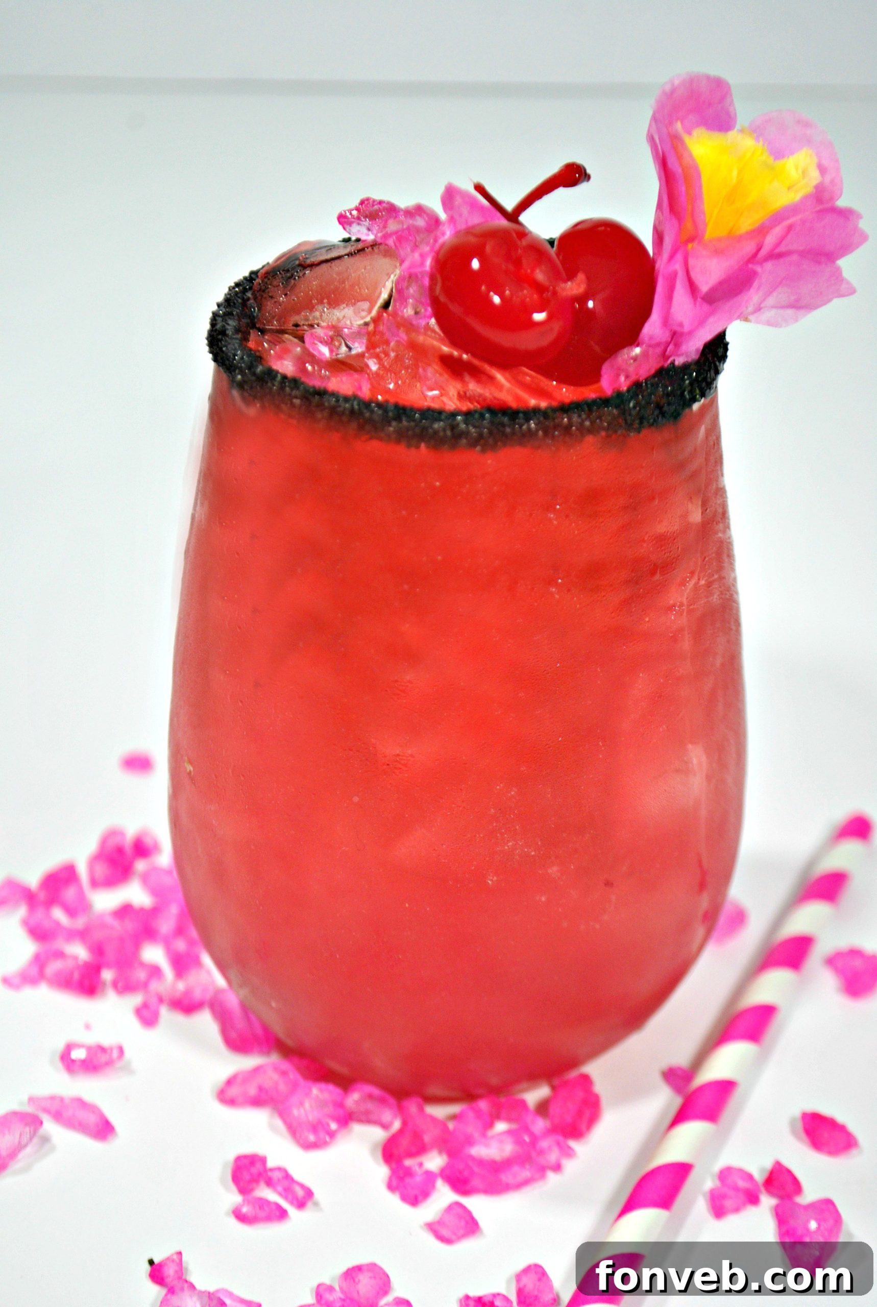 Overhead shot of two Bad Ass Barbie Cocktails with lime and cherry garnishes, perfectly arranged for a social gathering.
