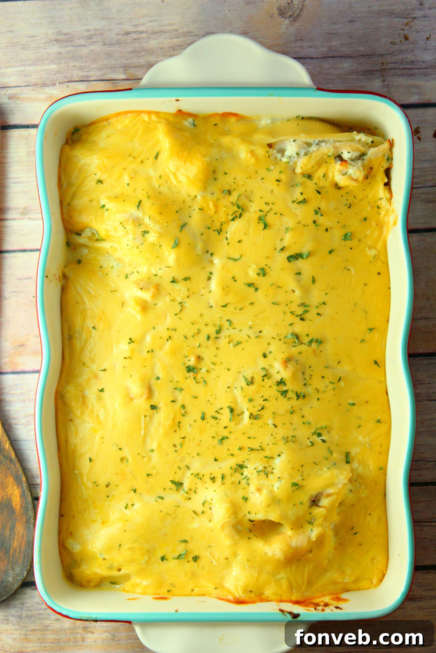 Creamy Garlic Chicken Stuffed Pasta Bake 3 Close-up of golden brown cheesy garlic chicken stuffed shells, hot and bubbling fresh from the oven.