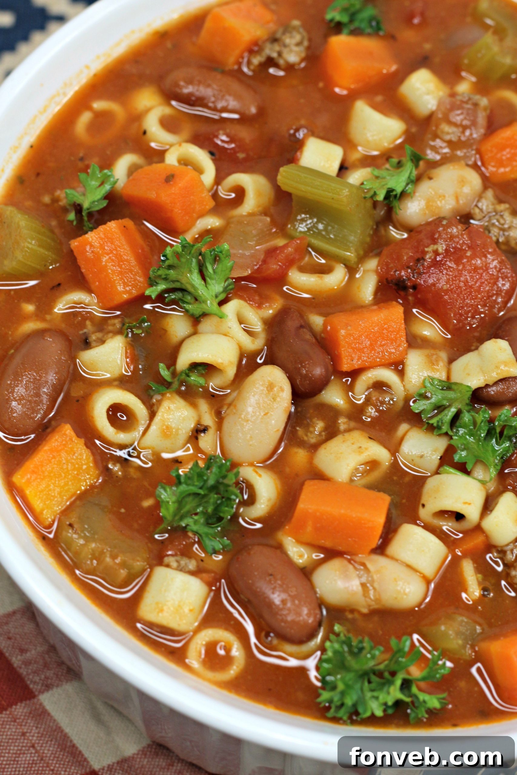 Overhead shot of diced carrots and celery, essential fresh ingredients for the soup
