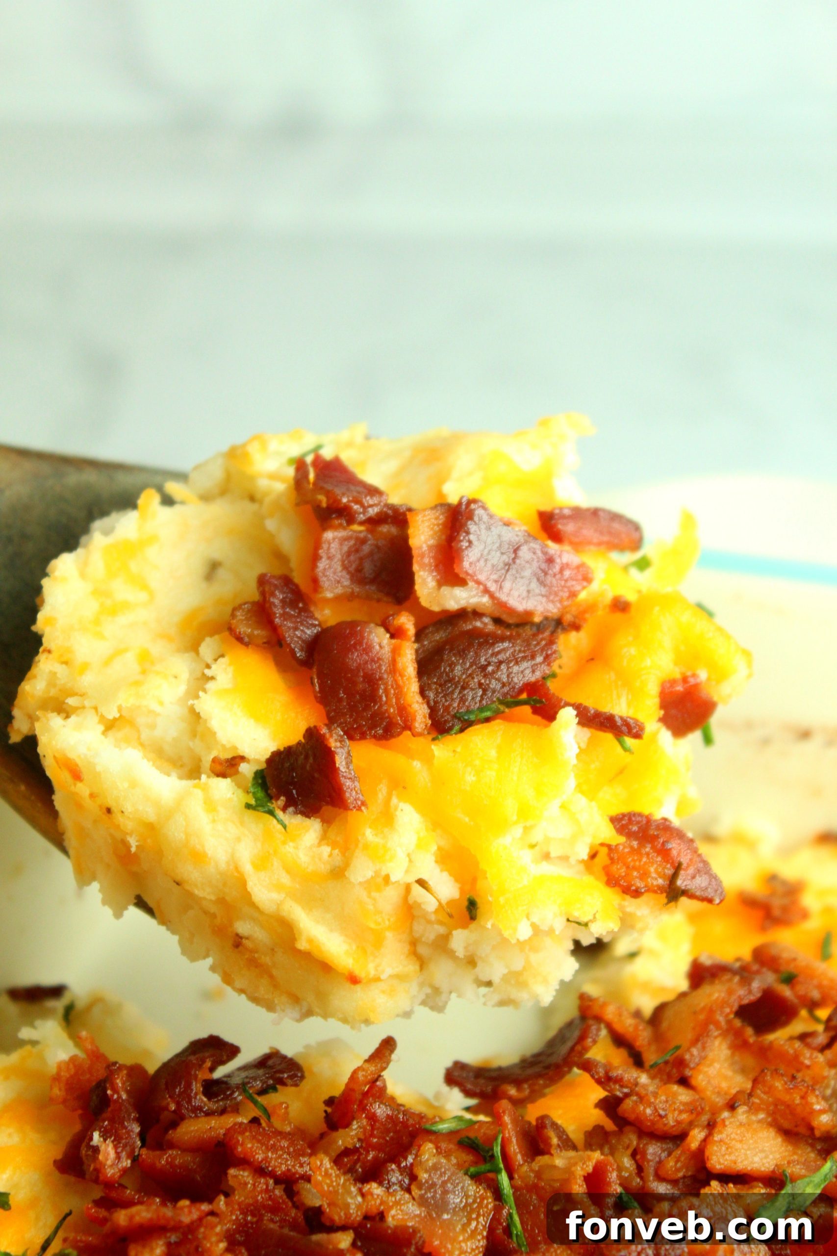 Ultimate Loaded Potato Bake 9 Another perspective of the loaded mashed potato casserole, with a focus on the rich, golden-brown topping.