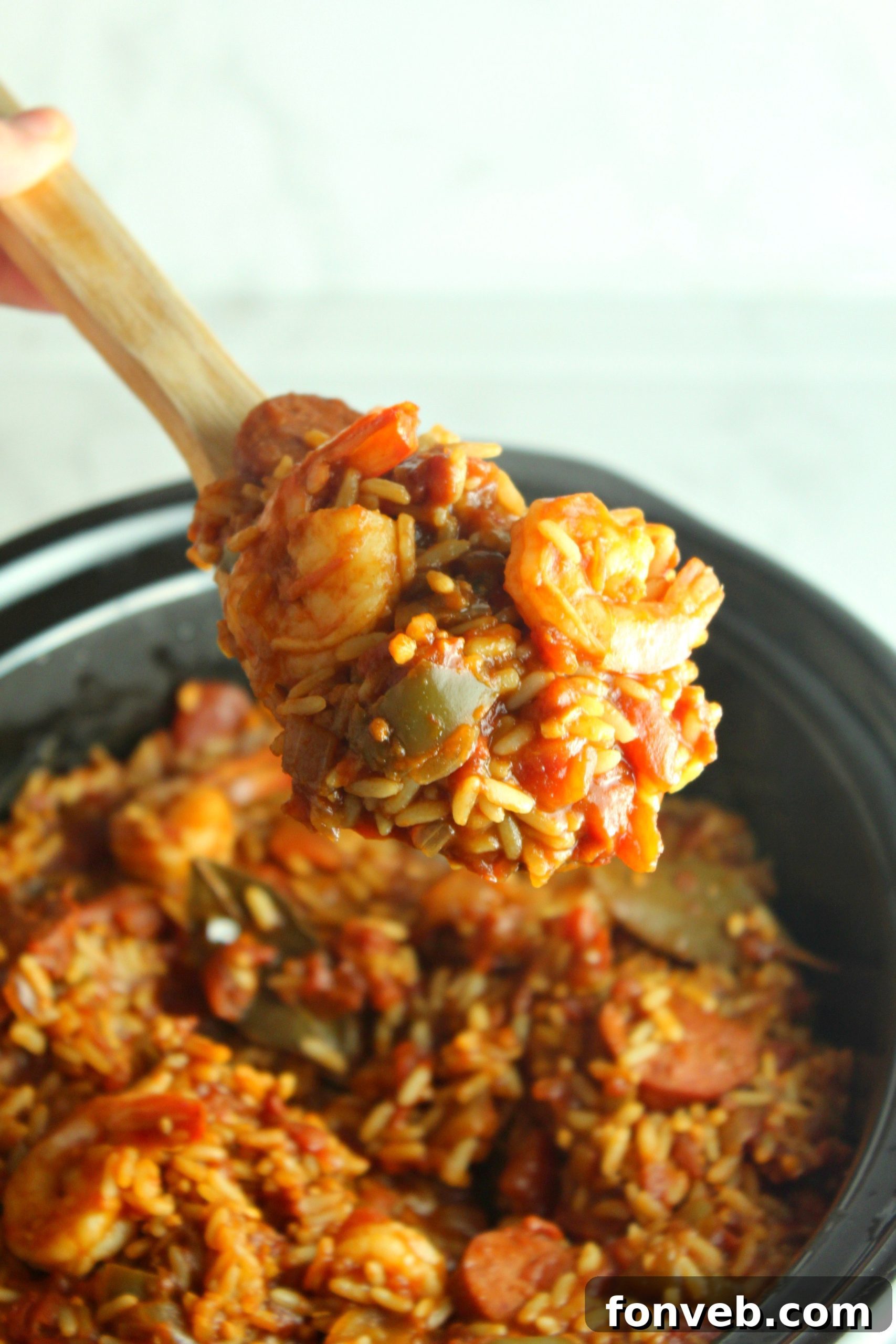 A bowl of Slow Cooker Jambalaya with extra shrimp visible, ready to be served