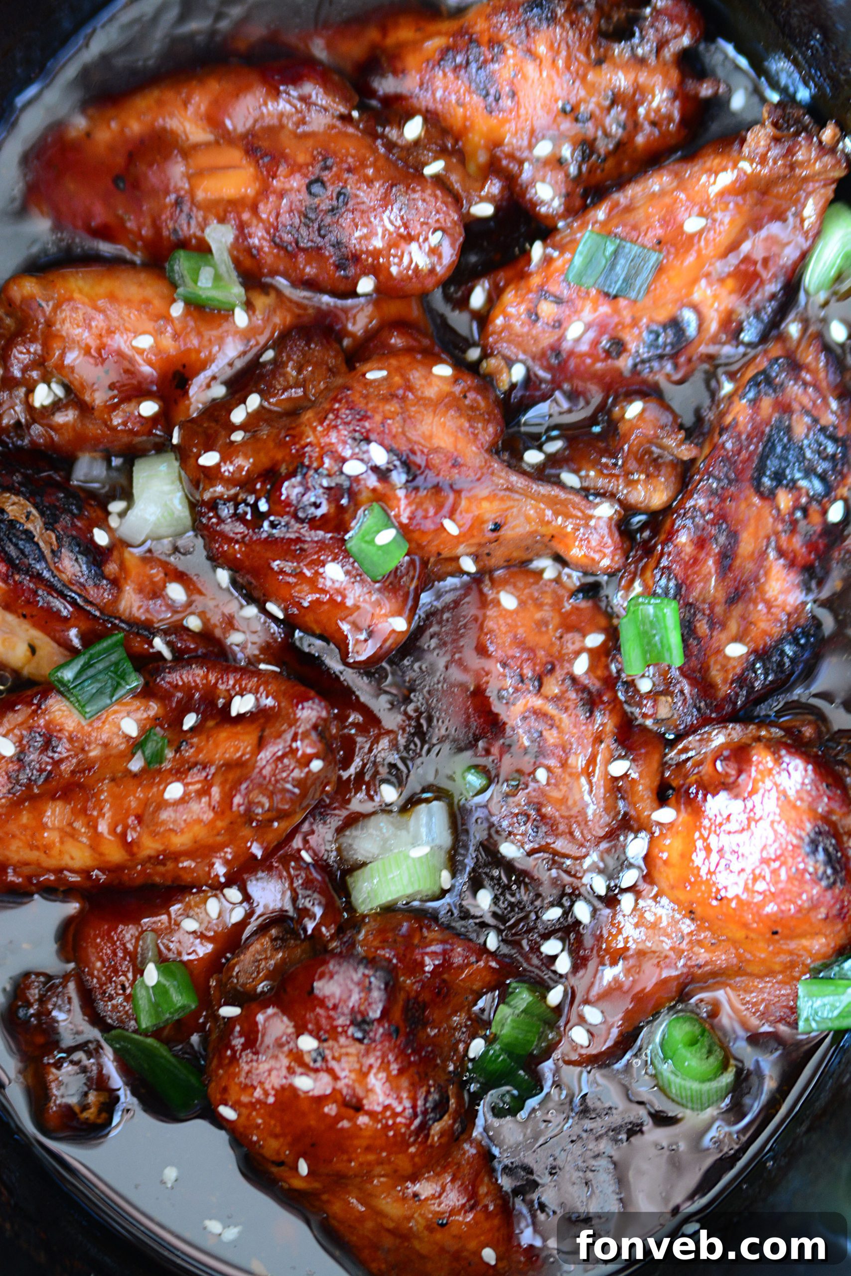 A close-up of tender Slow Cooker Chicken Teriyaki Wings arranged on a serving platter