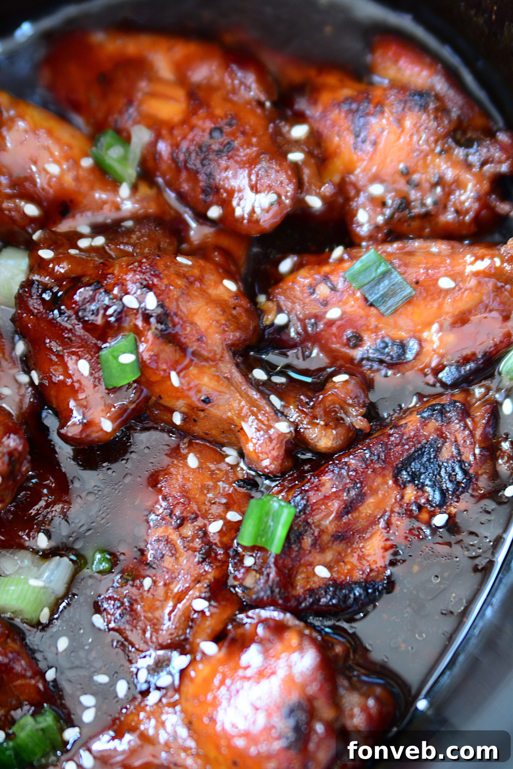A serving bowl filled with sticky Slow Cooker Chicken Teriyaki Wings