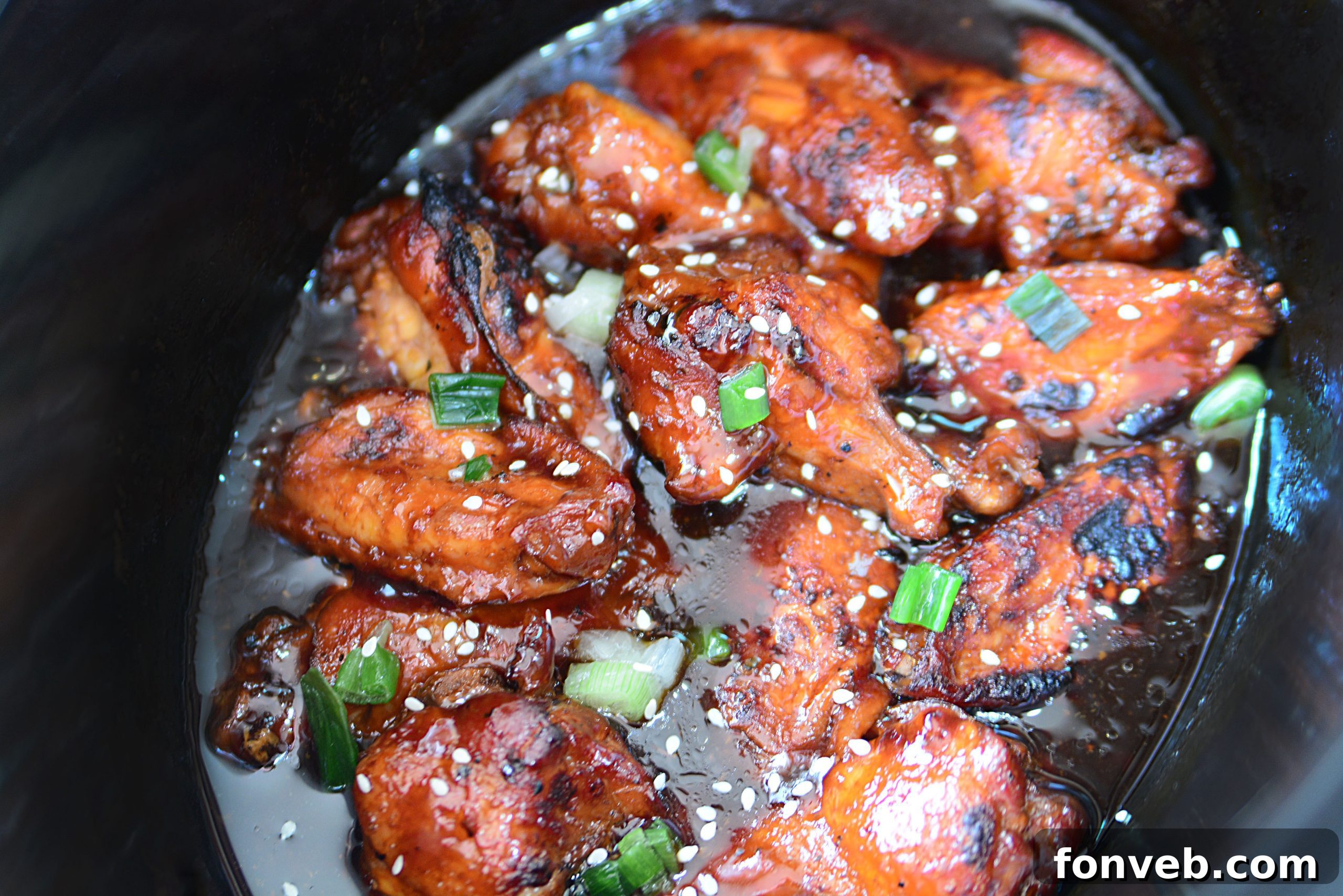 Close-up of a single Slow Cooker Chicken Teriyaki Wing, glistening with sauce
