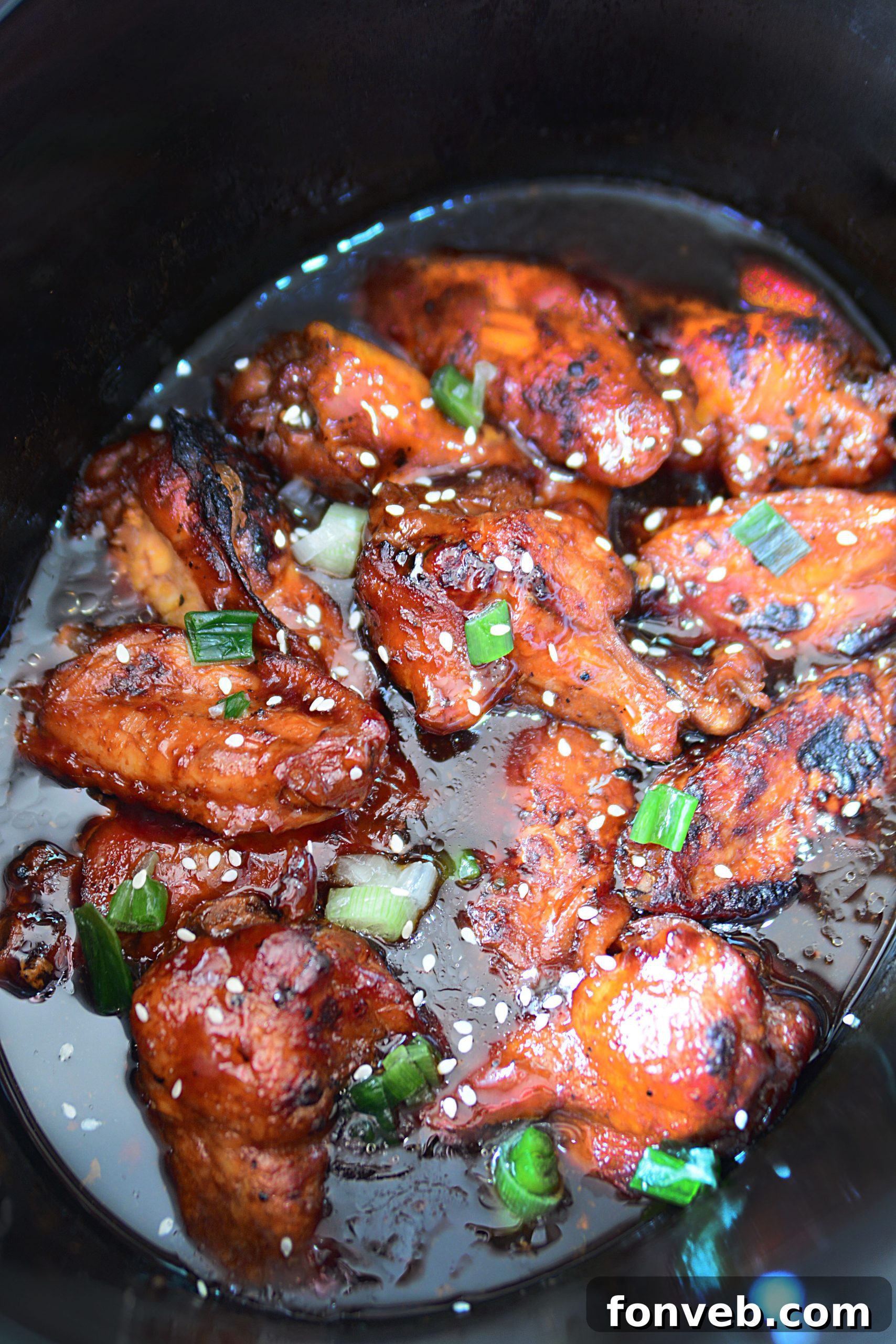 A large platter overflowing with Slow Cooker Chicken Teriyaki Wings, ready to be devoured