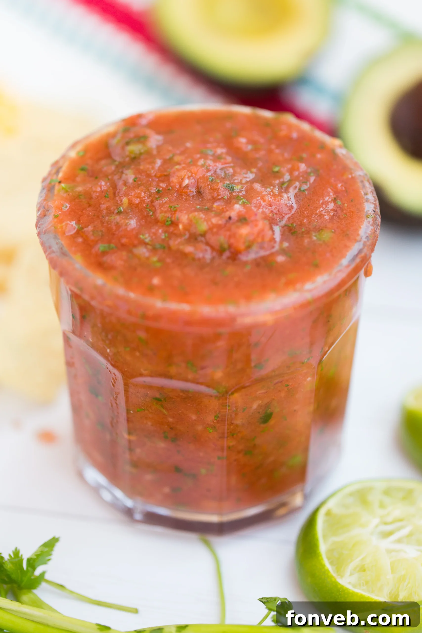 Signature Restaurant Salsa at Home 6 Close-up of Roma tomatoes and a jalapeño pepper charring on a hot griddle pan, creating smoky flavors essential for restaurant-style salsa.