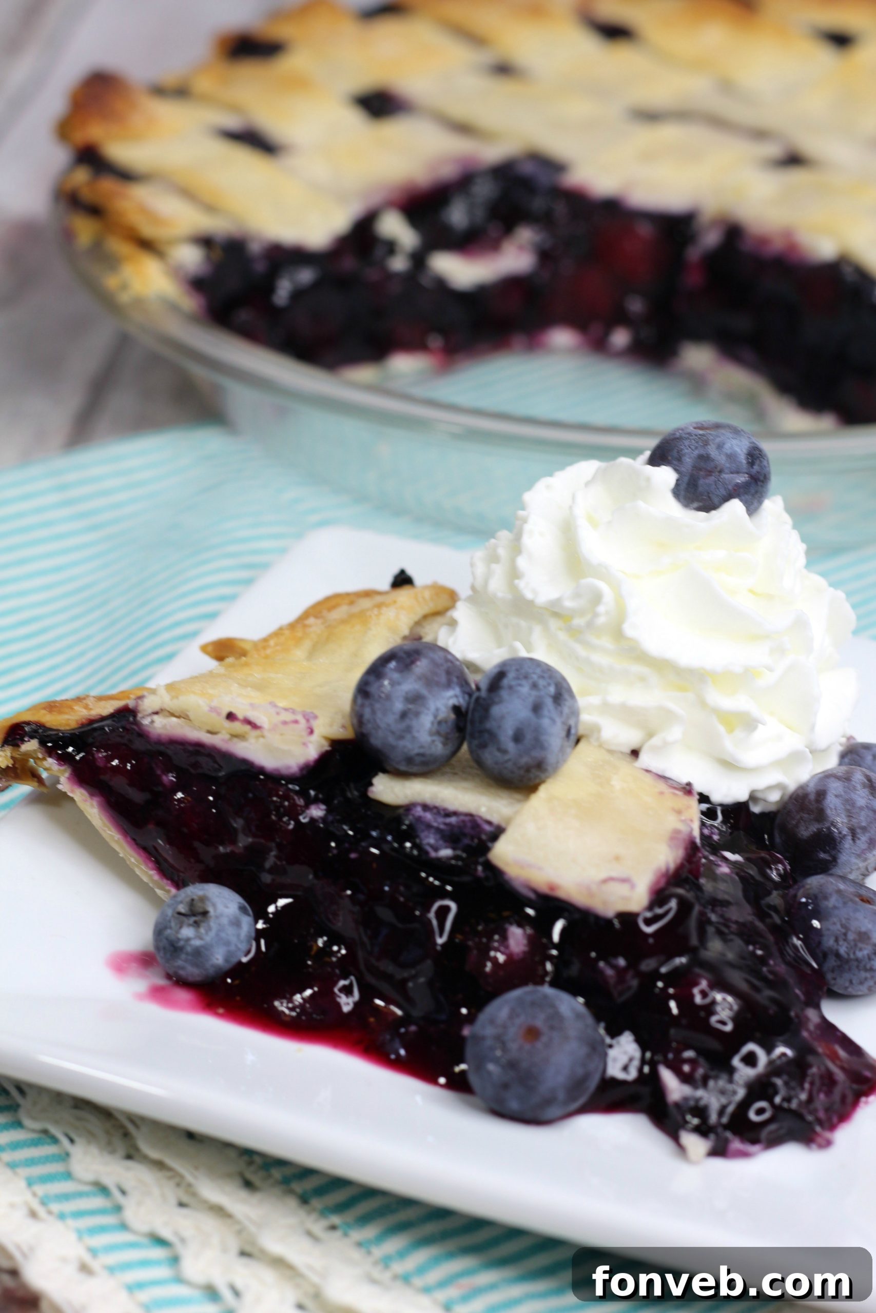 Bursting Blueberry Bliss 12 Slice of blueberry pie with ice cream and sparkling sugar
