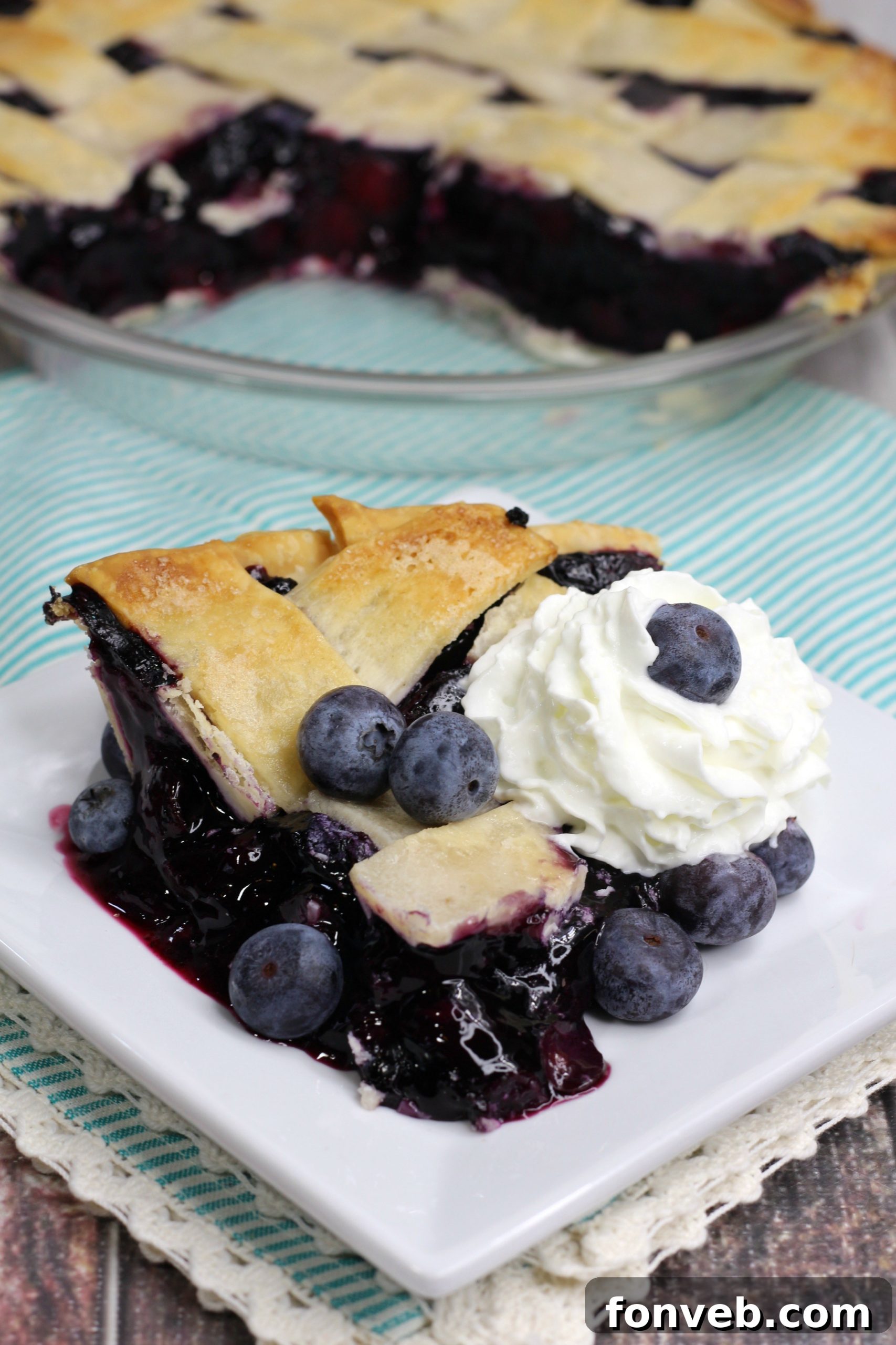 Bursting Blueberry Bliss 13 Blueberry pie with generous toppings of whipped cream and ice cream