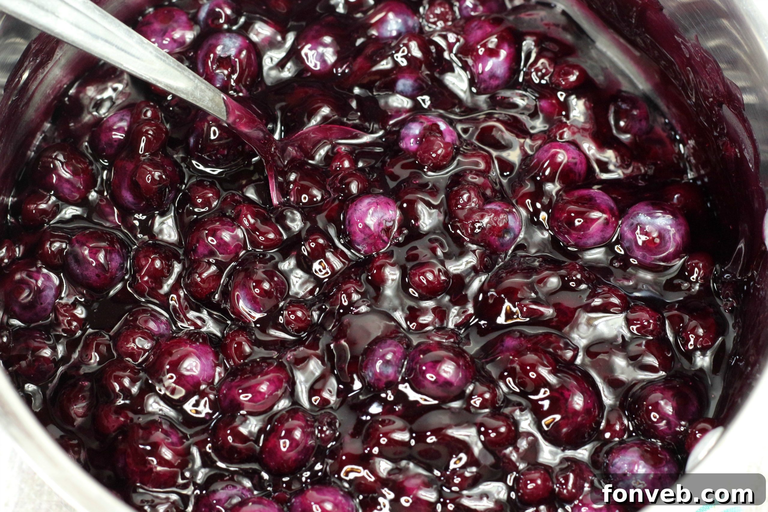 Bursting Blueberry Bliss 4 A slice of blueberry pie on a wooden board