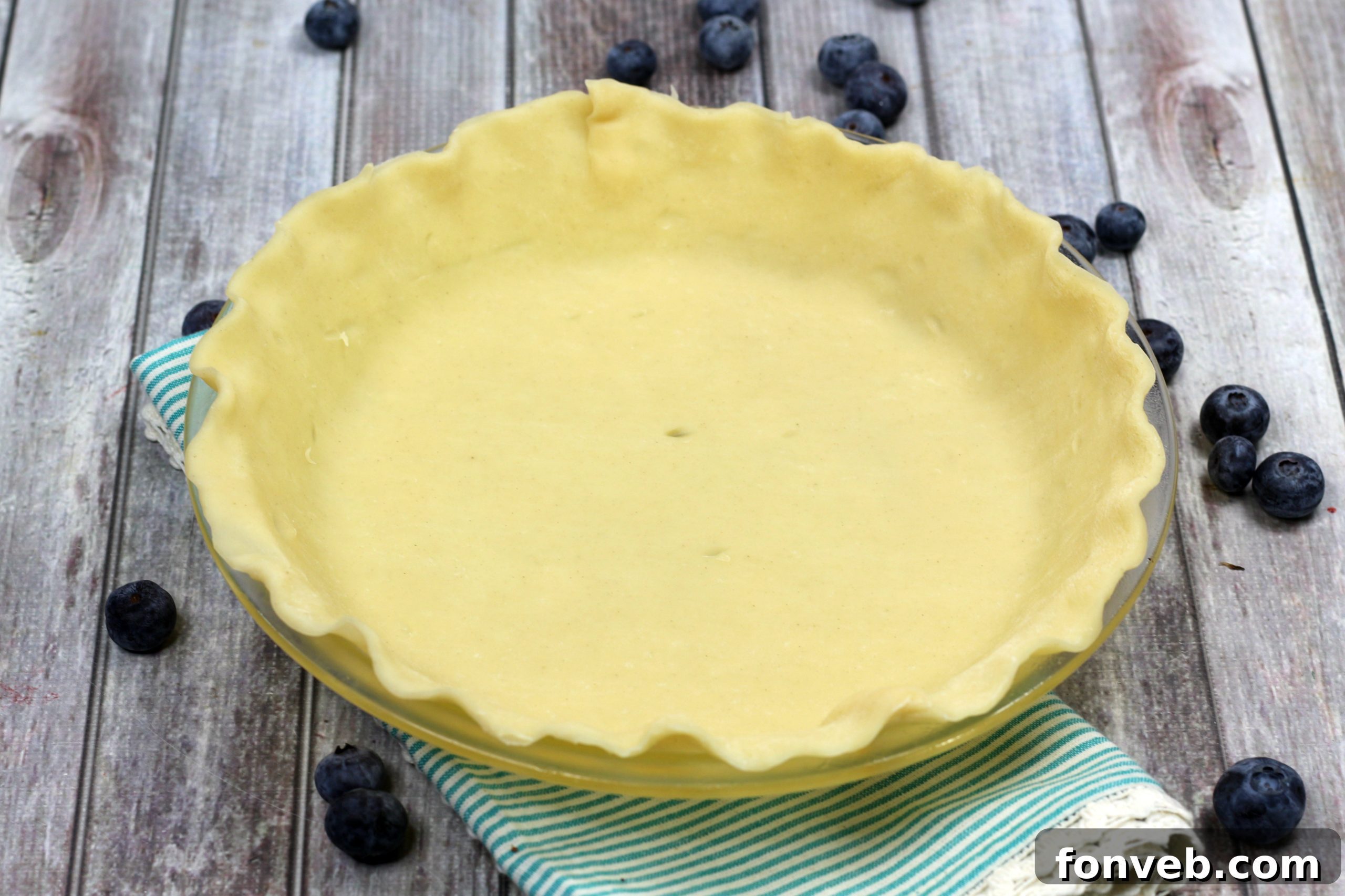 Bursting Blueberry Bliss 5 Hands preparing a lattice crust for blueberry pie