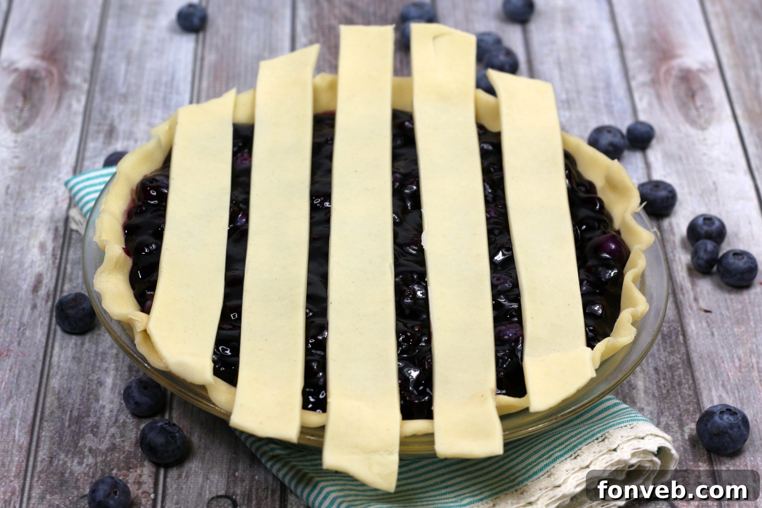 Bursting Blueberry Bliss 7 A fork taking a bite of blueberry pie
