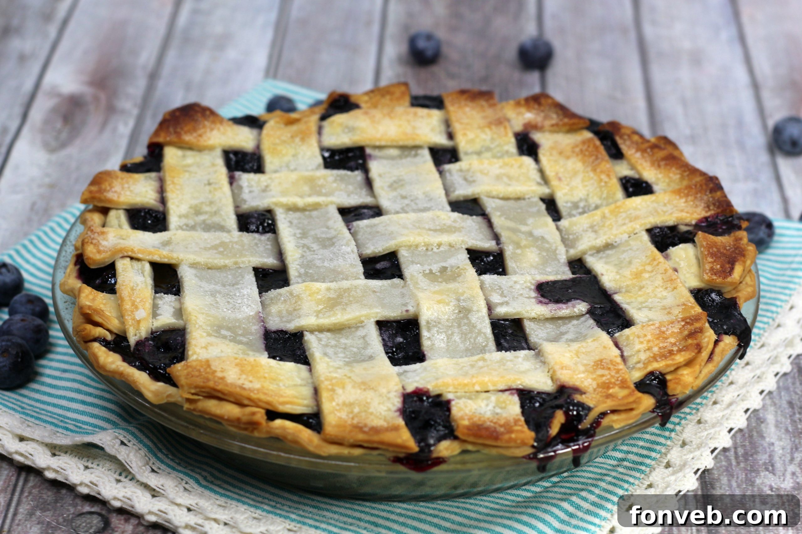 Bursting Blueberry Bliss 10 Blueberry pie, ready to be sliced