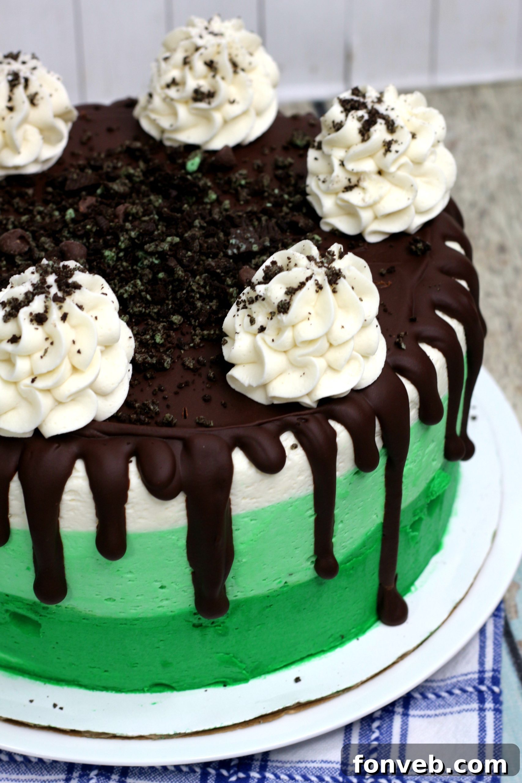 Cool Mint Oreo Decadence 5 Another perspective of the Mint Oreo Layered Cake, showcasing its impressive height and decorative top with crushed Oreos.