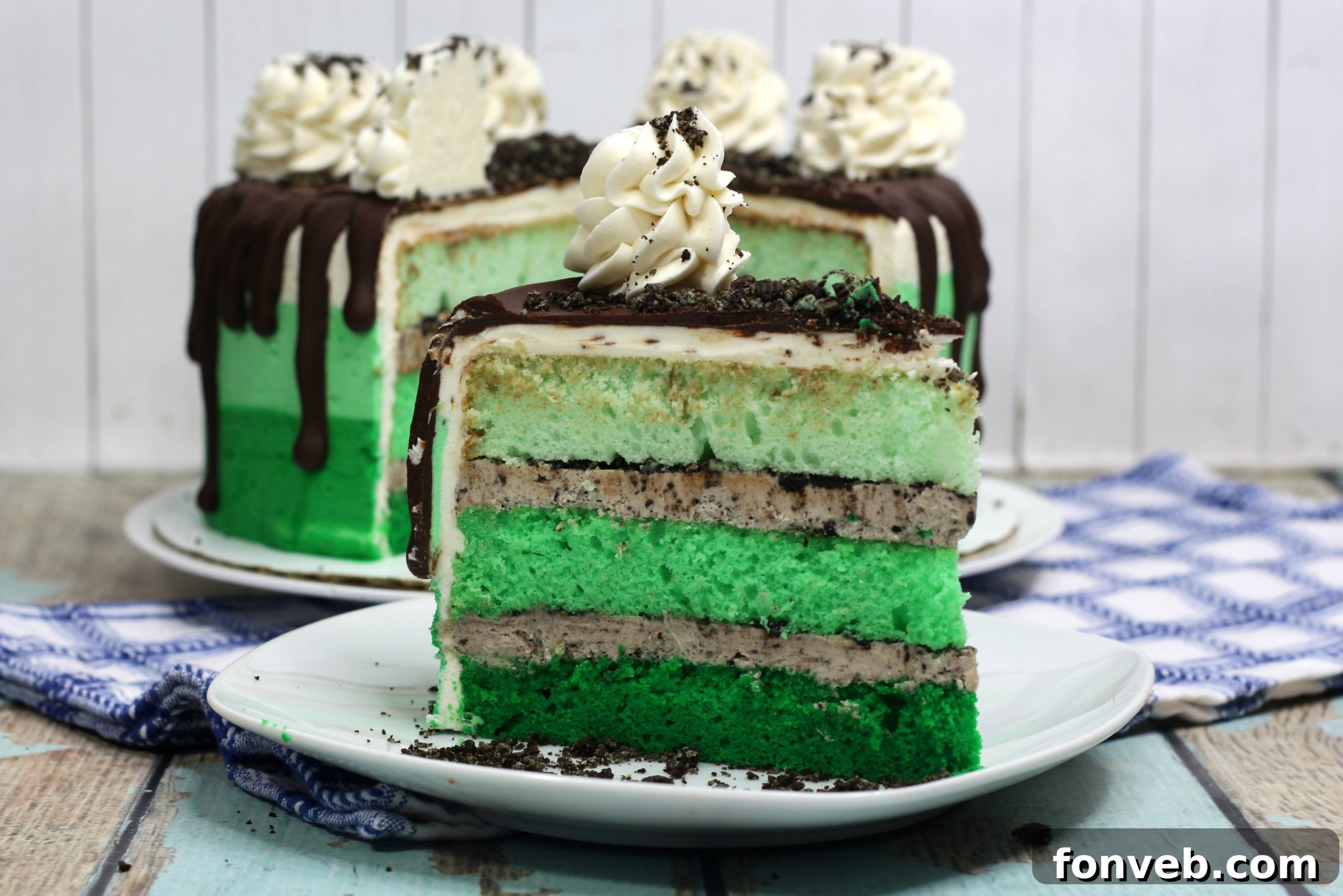 Cool Mint Oreo Decadence 6 Side view of the Mint Oreo Layered Cake, highlighting the smooth ombre frosting and the rich chocolate ganache drip.