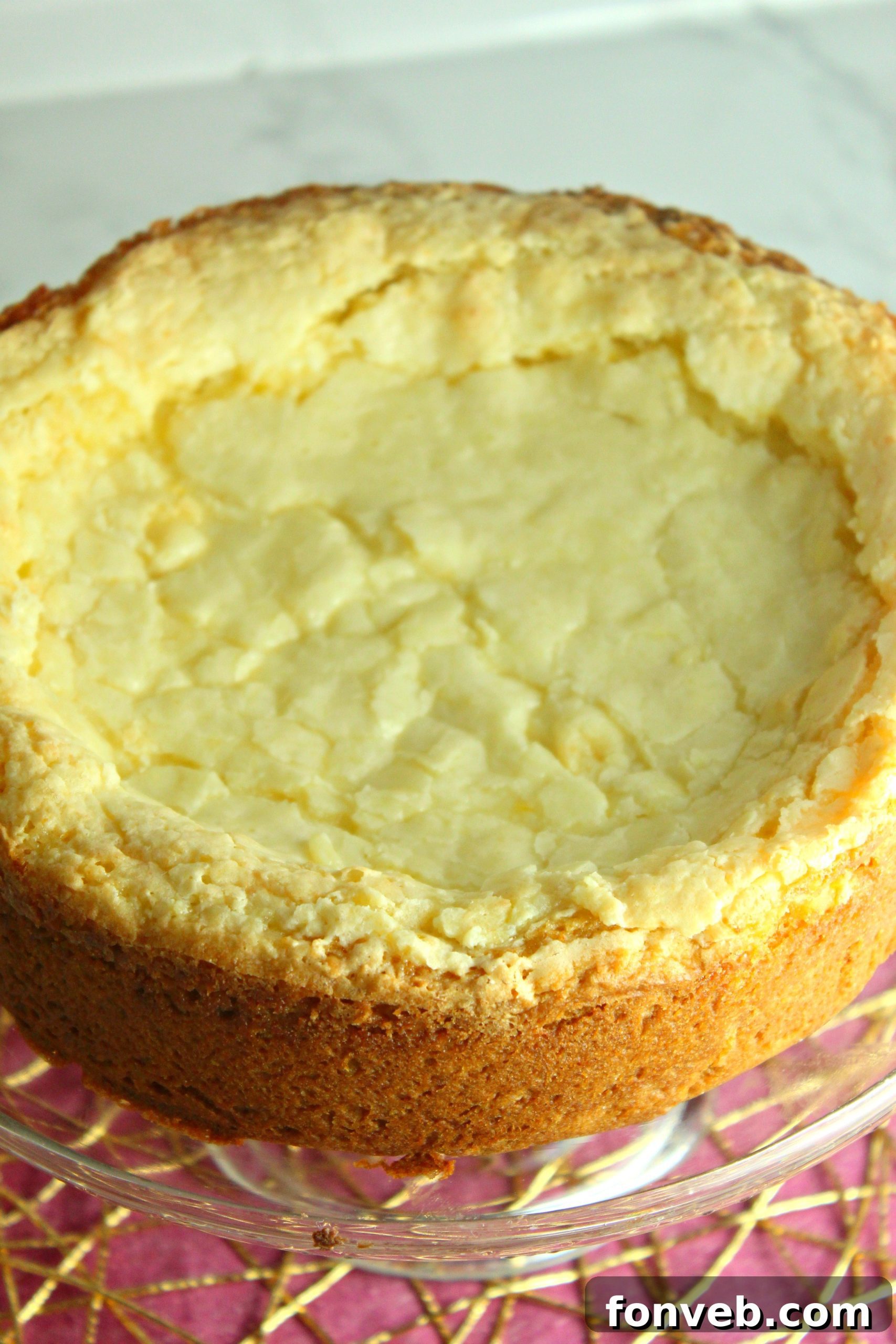 Deliciously moist Ooey Gooey Butter Cake, golden brown with a creamy topping.