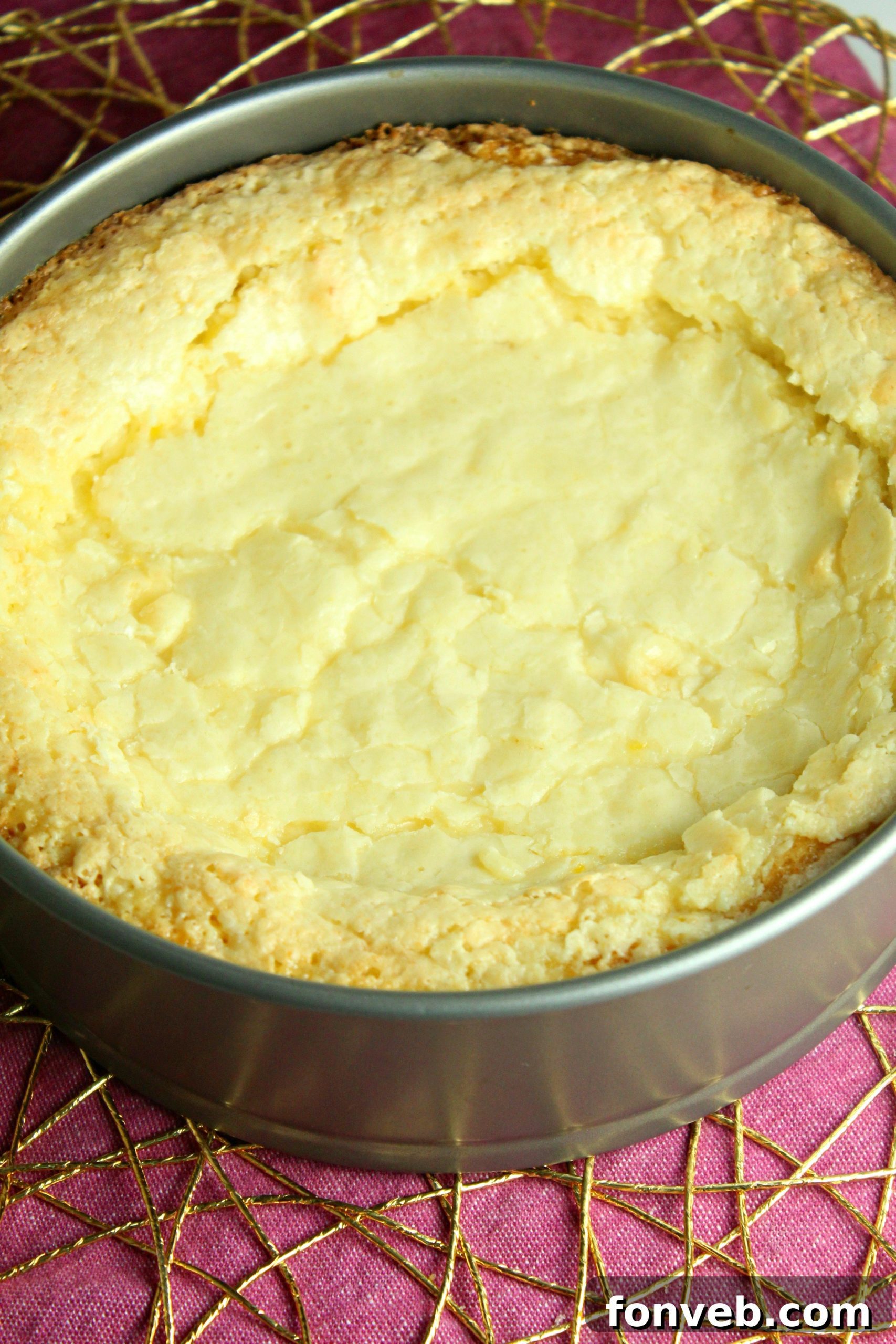 Close-up of a slice of Ooey Gooey Butter Cake, showcasing its two distinct layers.