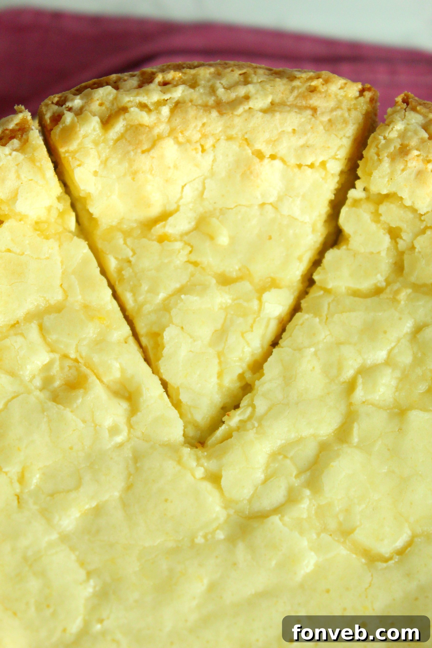 Freshly baked Ooey Gooey Butter Cake cooling on a wire rack.