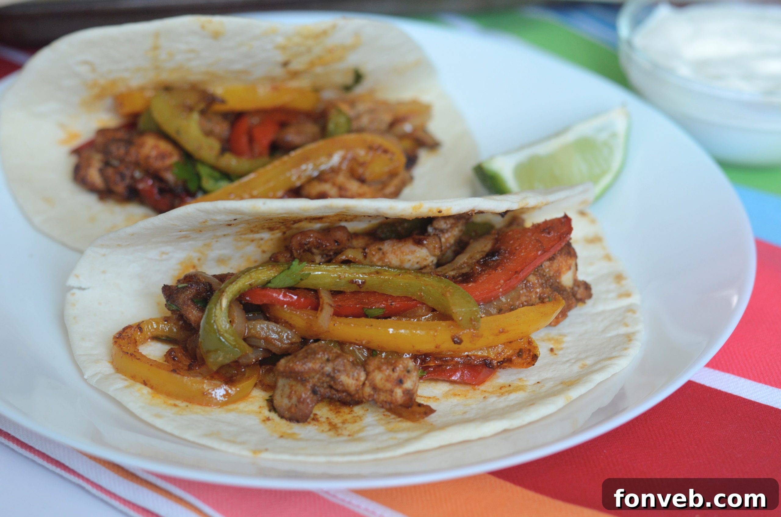 Delicious Sheet Pan Chicken Fajitas with colorful bell peppers and onions, ready to be served.